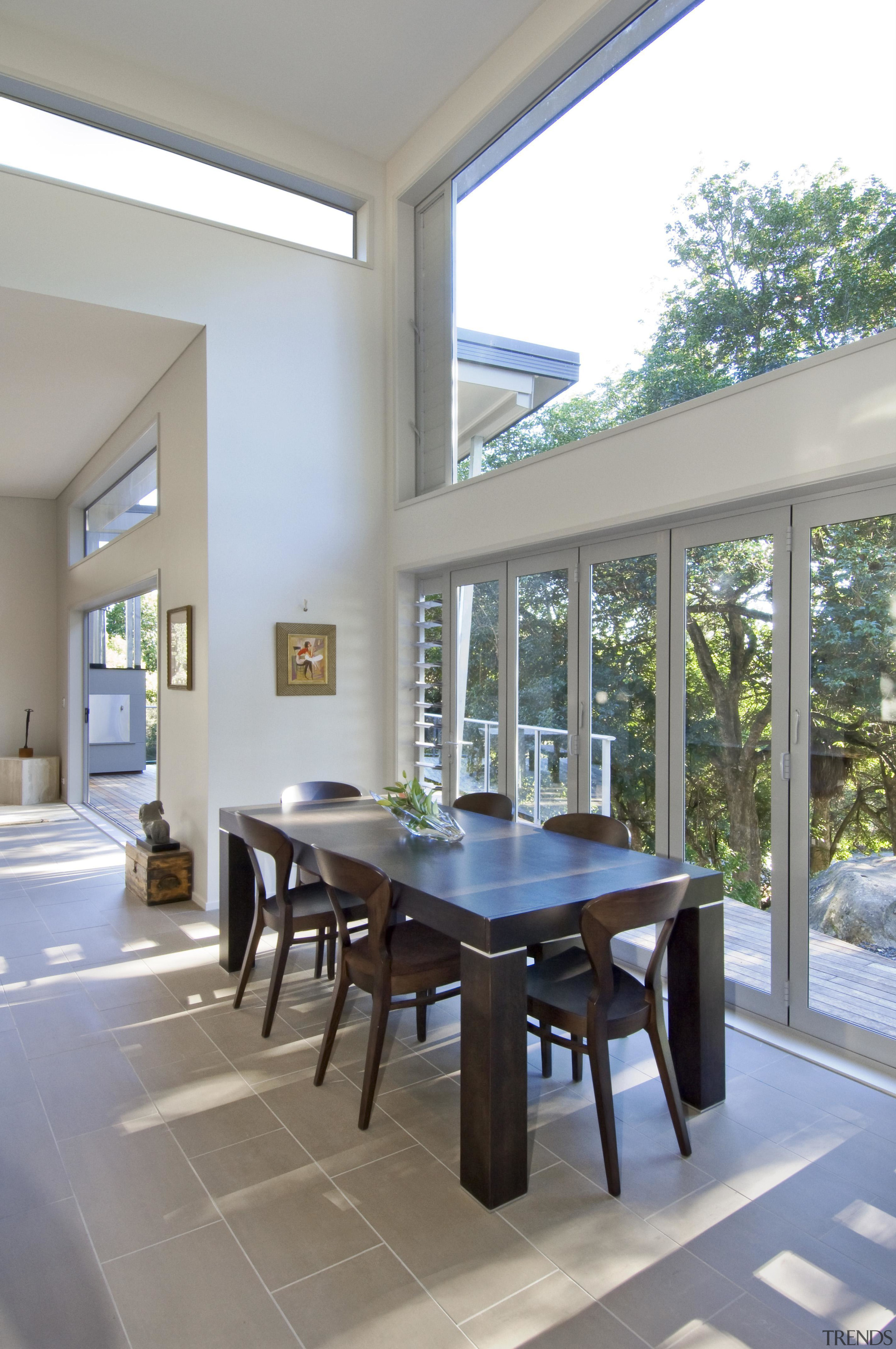 Bright dining area with wooden furniture - Landmark architecture, chair, daylighting, dining room, furniture, house, interior design, real estate, table, window, gray