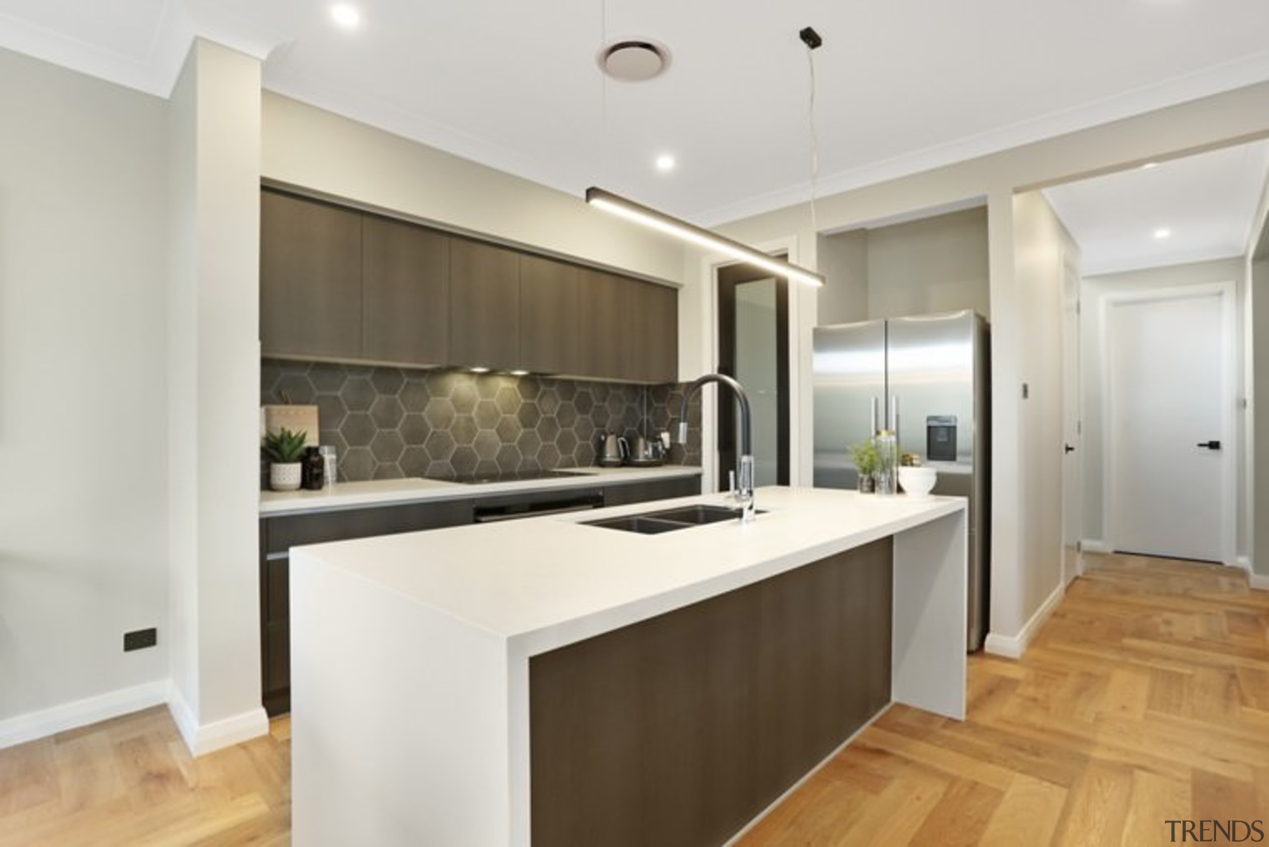 A hexagonal splashback creates an interesting focal point cabinetry, countertop, floor, interior design, kitchen, property, real estate, room, white, gray