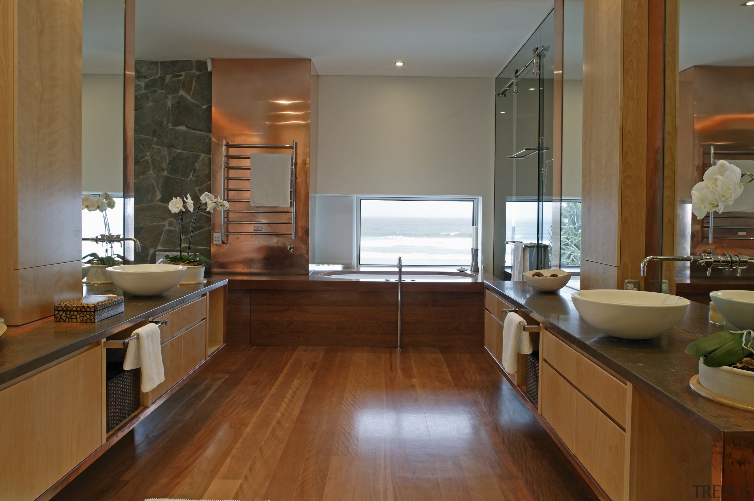 A view of the master ensuite featuring stained cabinetry, countertop, floor, flooring, hardwood, interior design, kitchen, room, window, wood, wood flooring, brown, gray