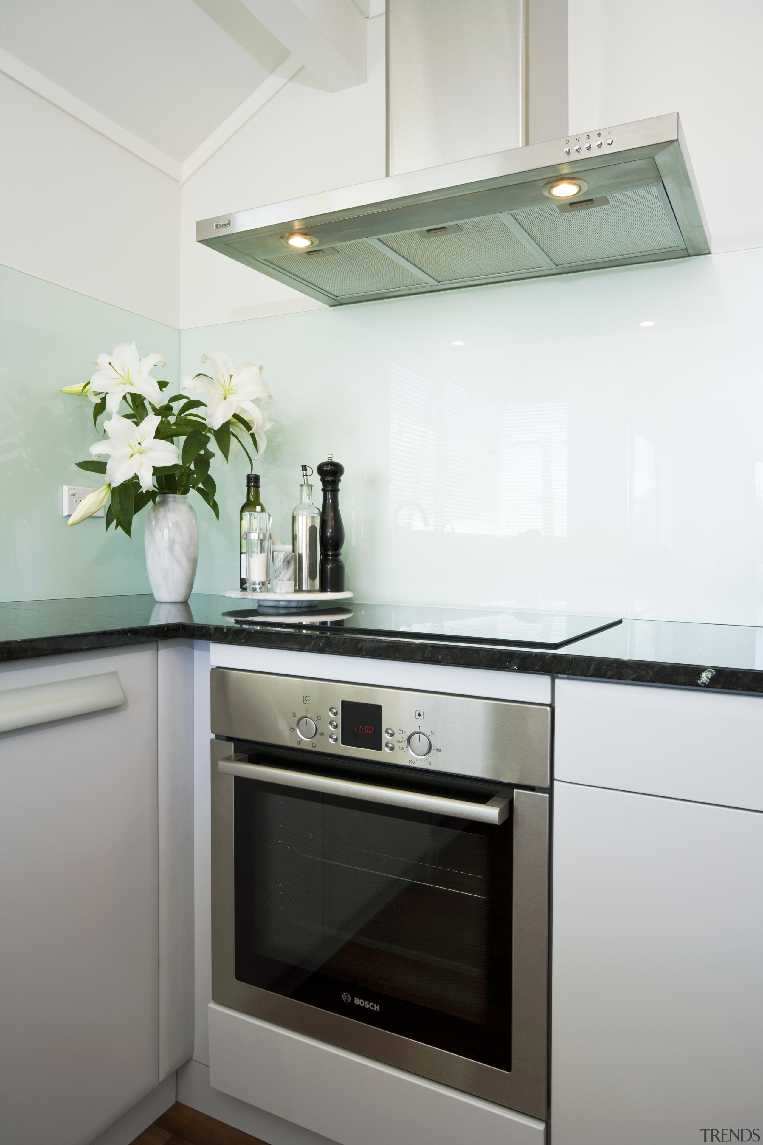 View of a kitchen designed by Denele Design cabinetry, countertop, home, home appliance, interior design, kitchen, kitchen appliance, kitchen stove, major appliance, room, white