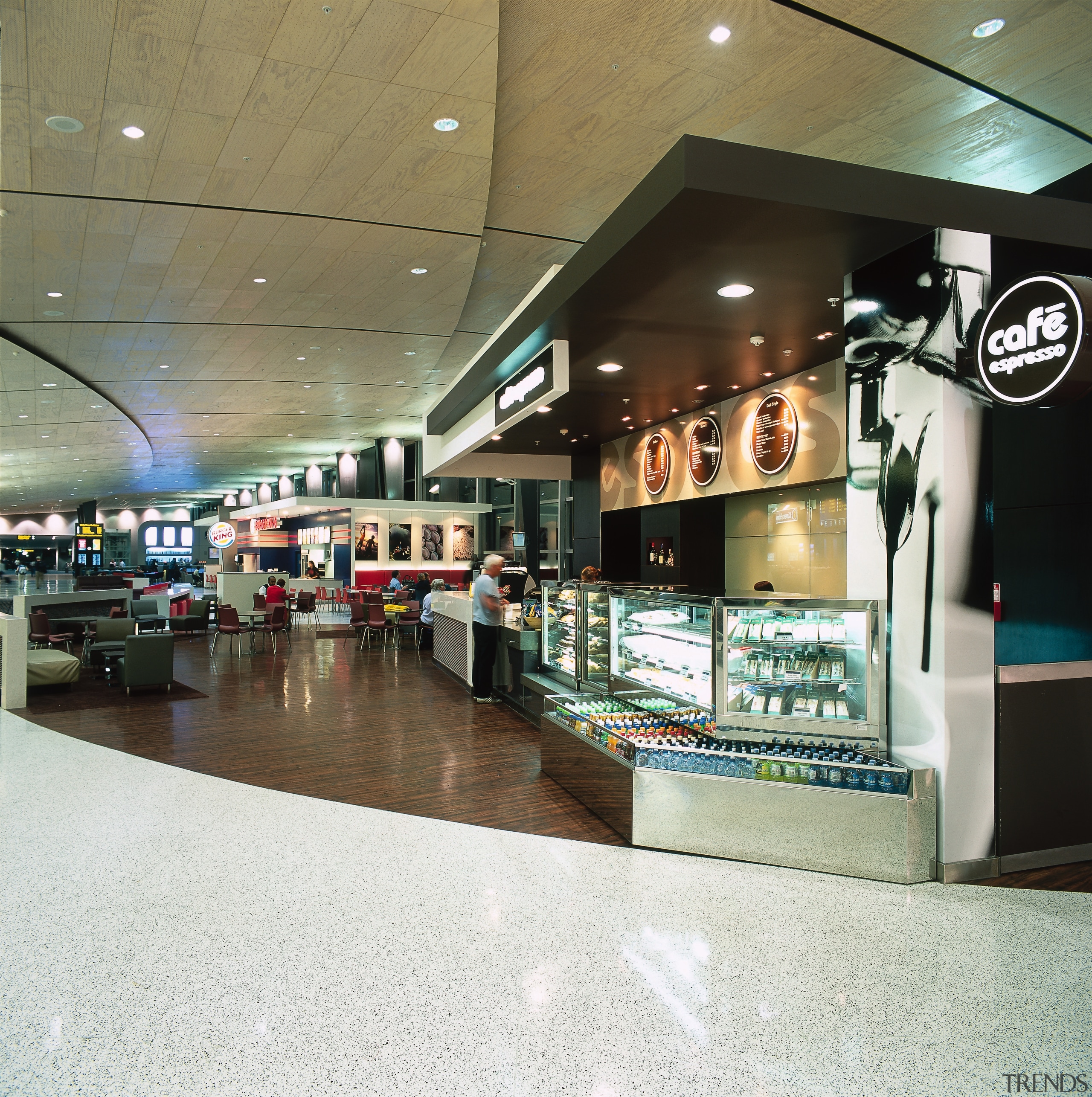 Food court area with curved lines in floors interior design, retail, shopping mall, white, brown