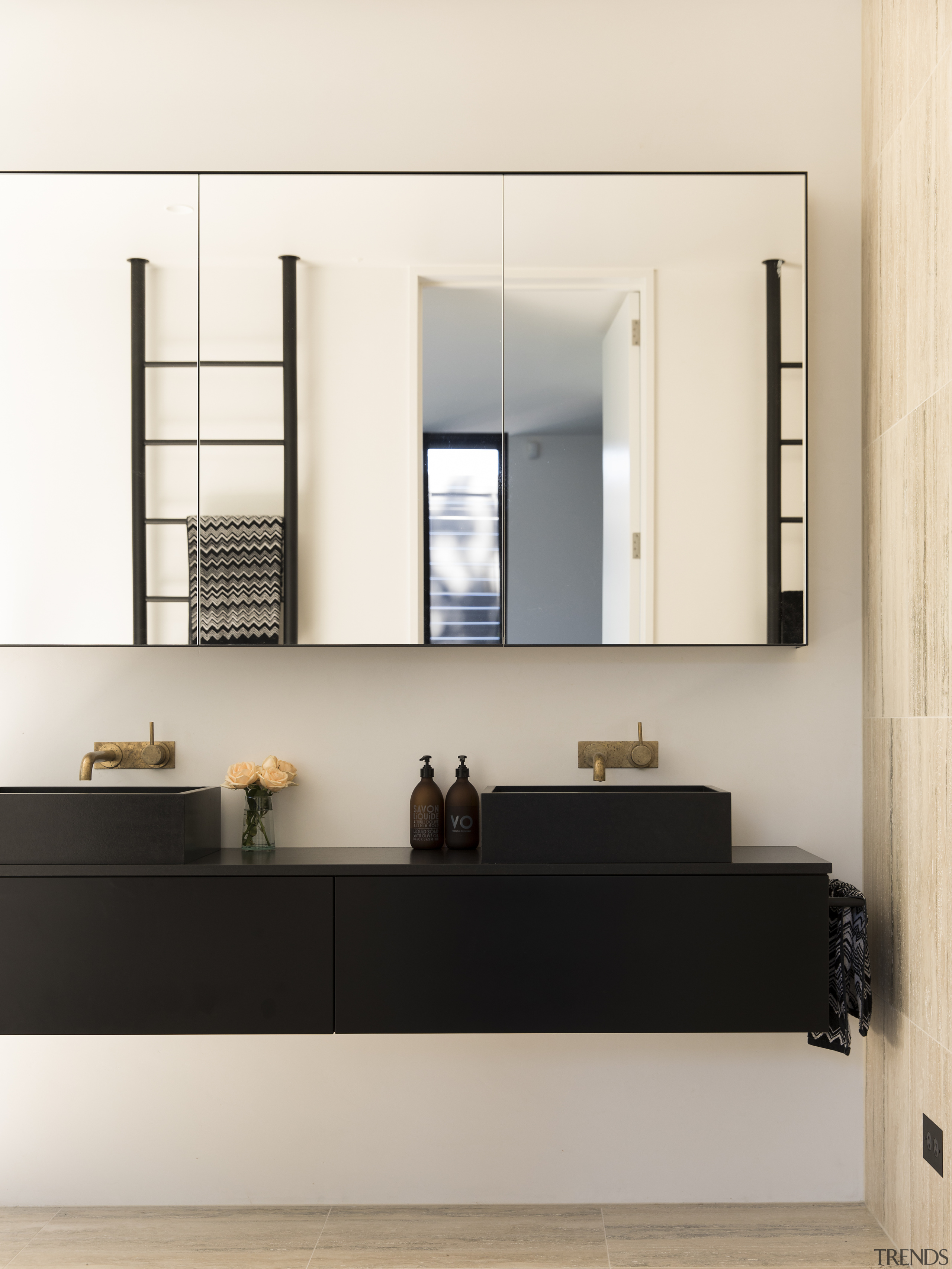 In direct contrast to the curvaceous tub, the bathroom accessory, floor, furniture, interior design, shelf, white