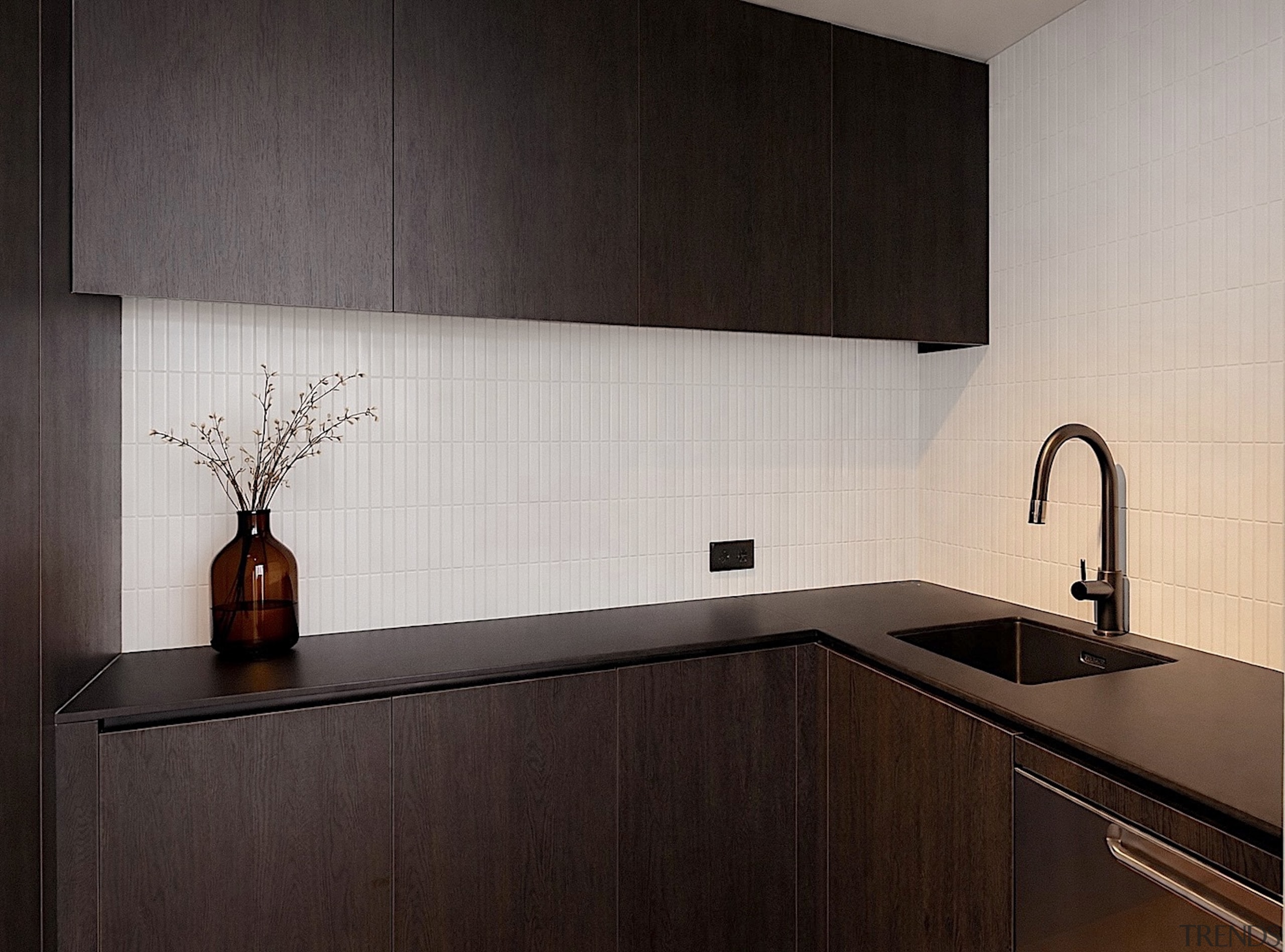 A concealed butler pantry provides a secondary workspace 
