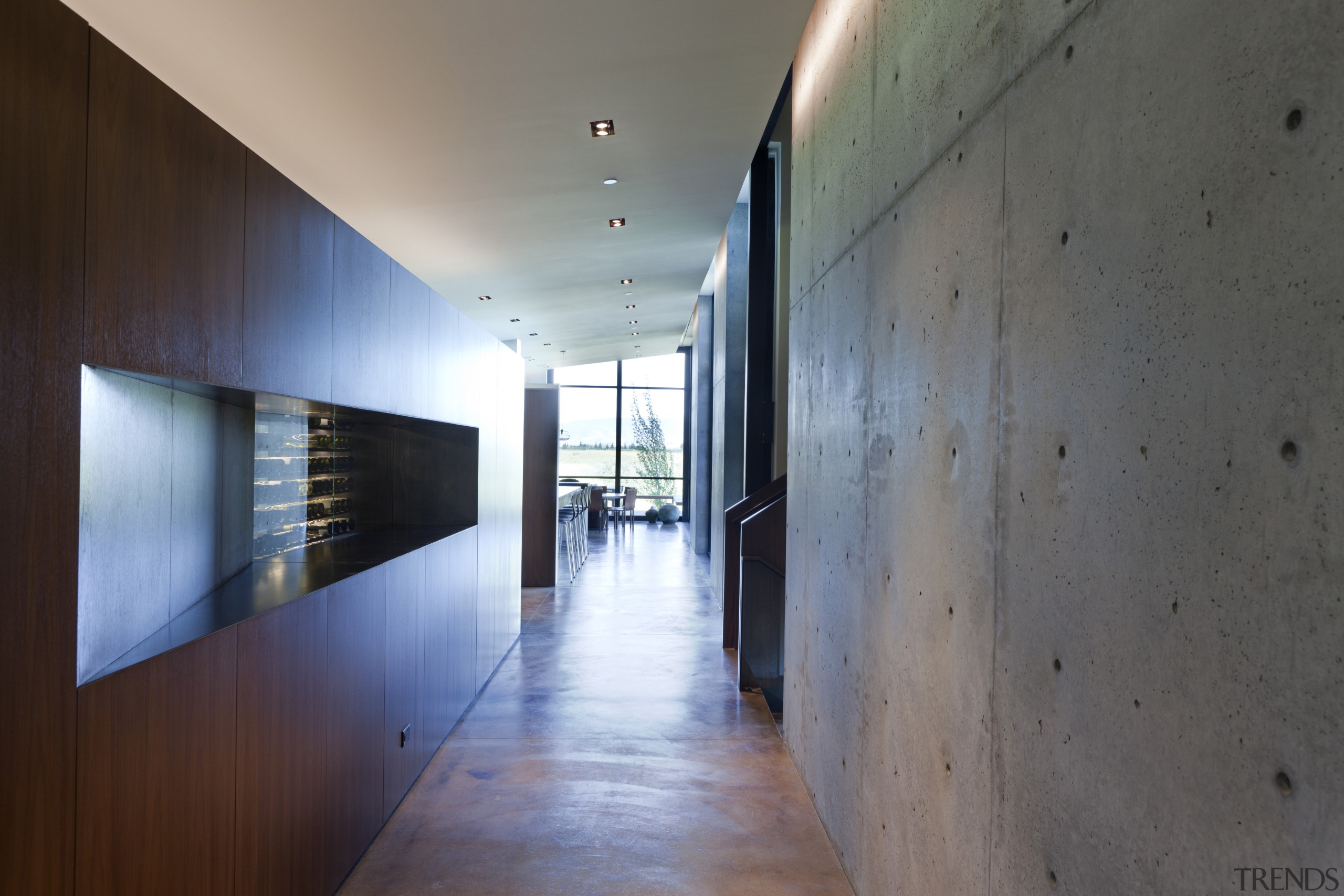 The walnut cabinetry divides the interior  living architecture, daylighting, house, interior design, lobby, wood, gray