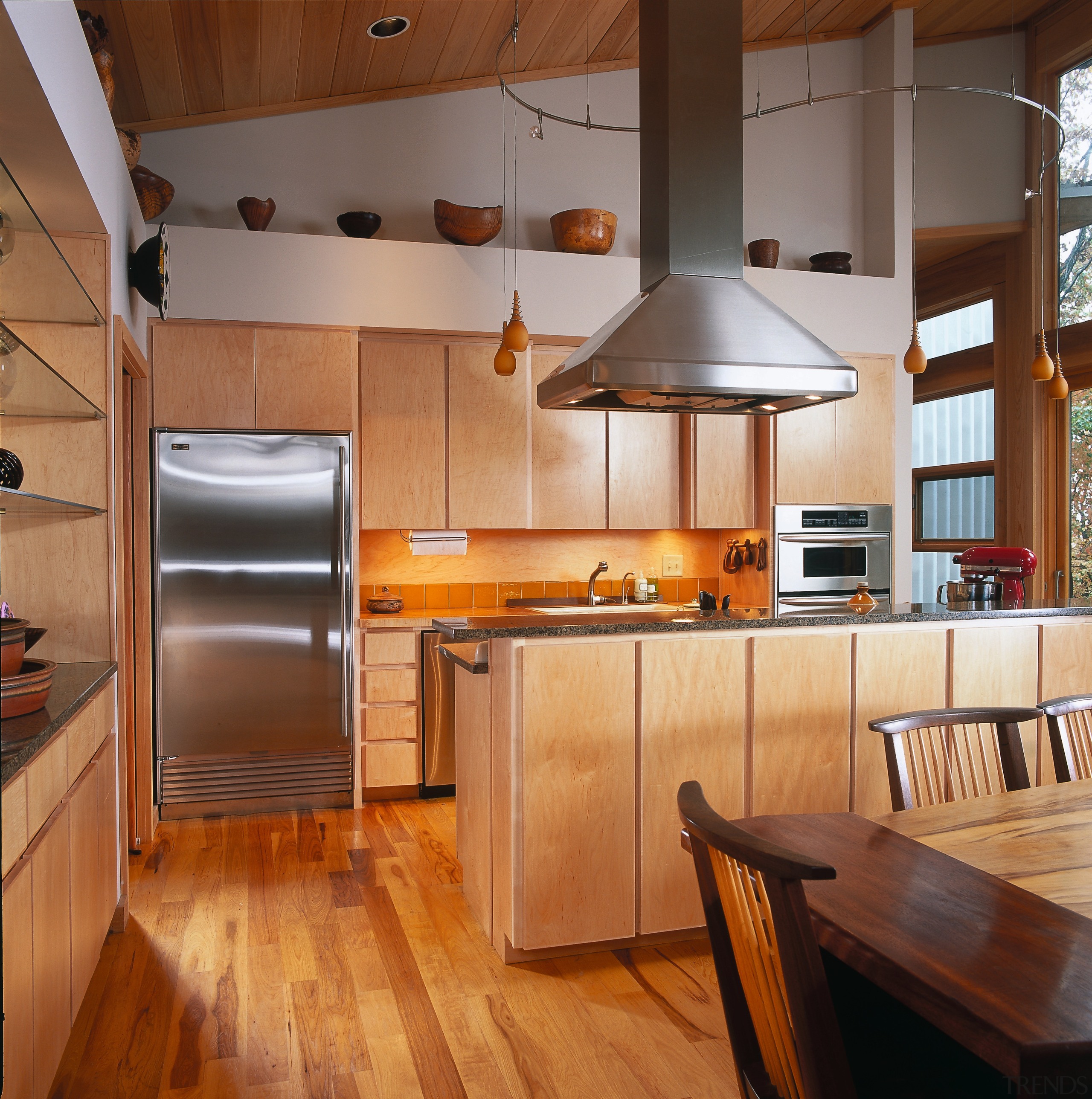 View of a kitchen, wooden flooring, cabinetry, dining cabinetry, ceiling, countertop, cuisine classique, flooring, hardwood, interior design, kitchen, real estate, wood, wood flooring, brown, orange