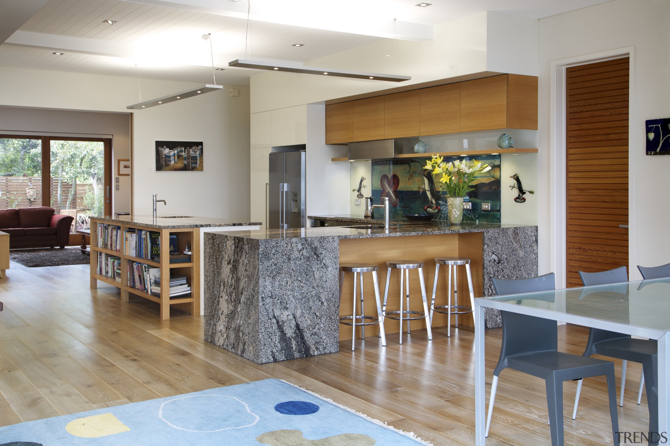 The open-plan dining and kitchen area in this floor, flooring, house, interior design, real estate, room, table, gray