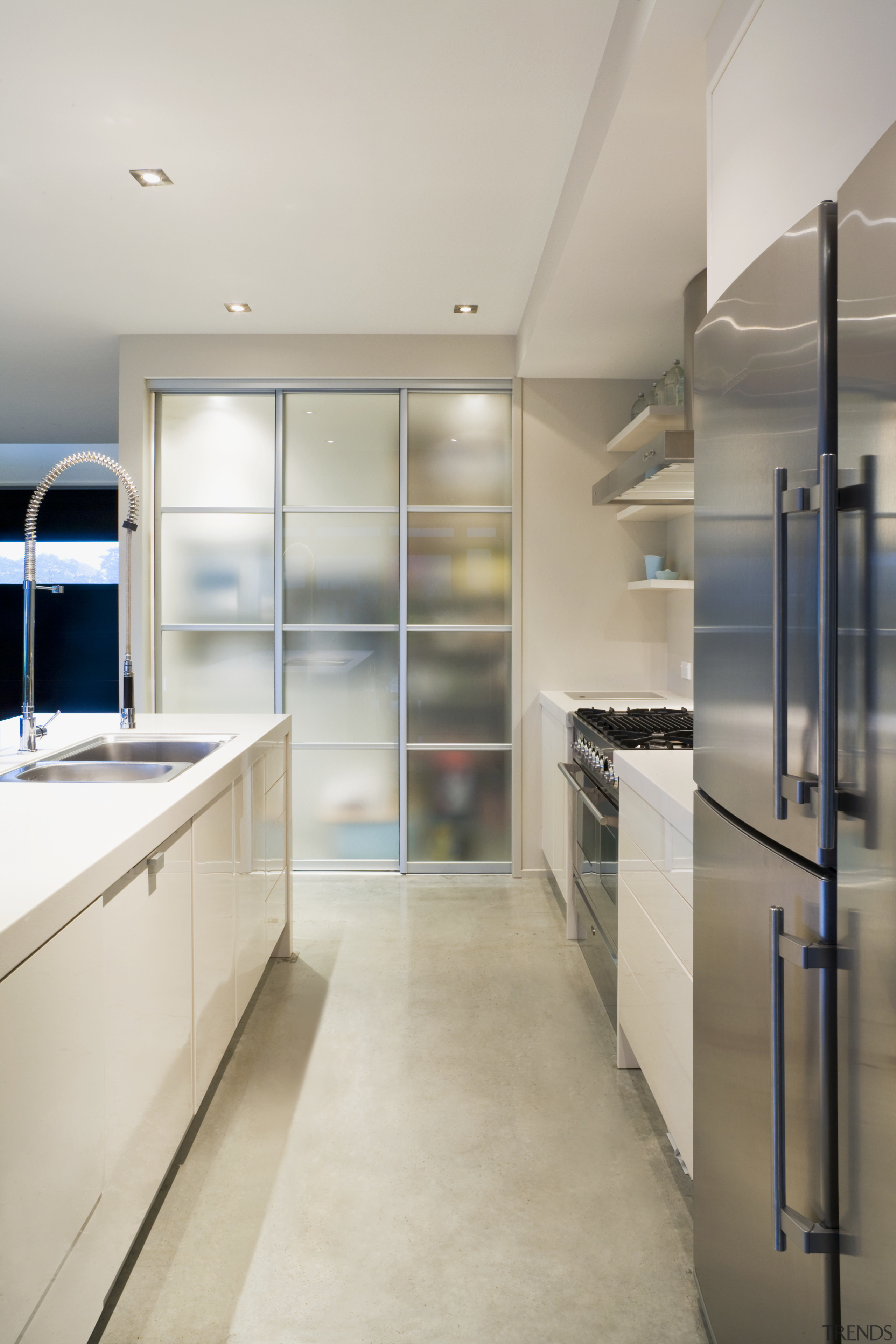 View of a kitchen which features underfloor heating cabinetry, countertop, floor, interior design, kitchen, gray