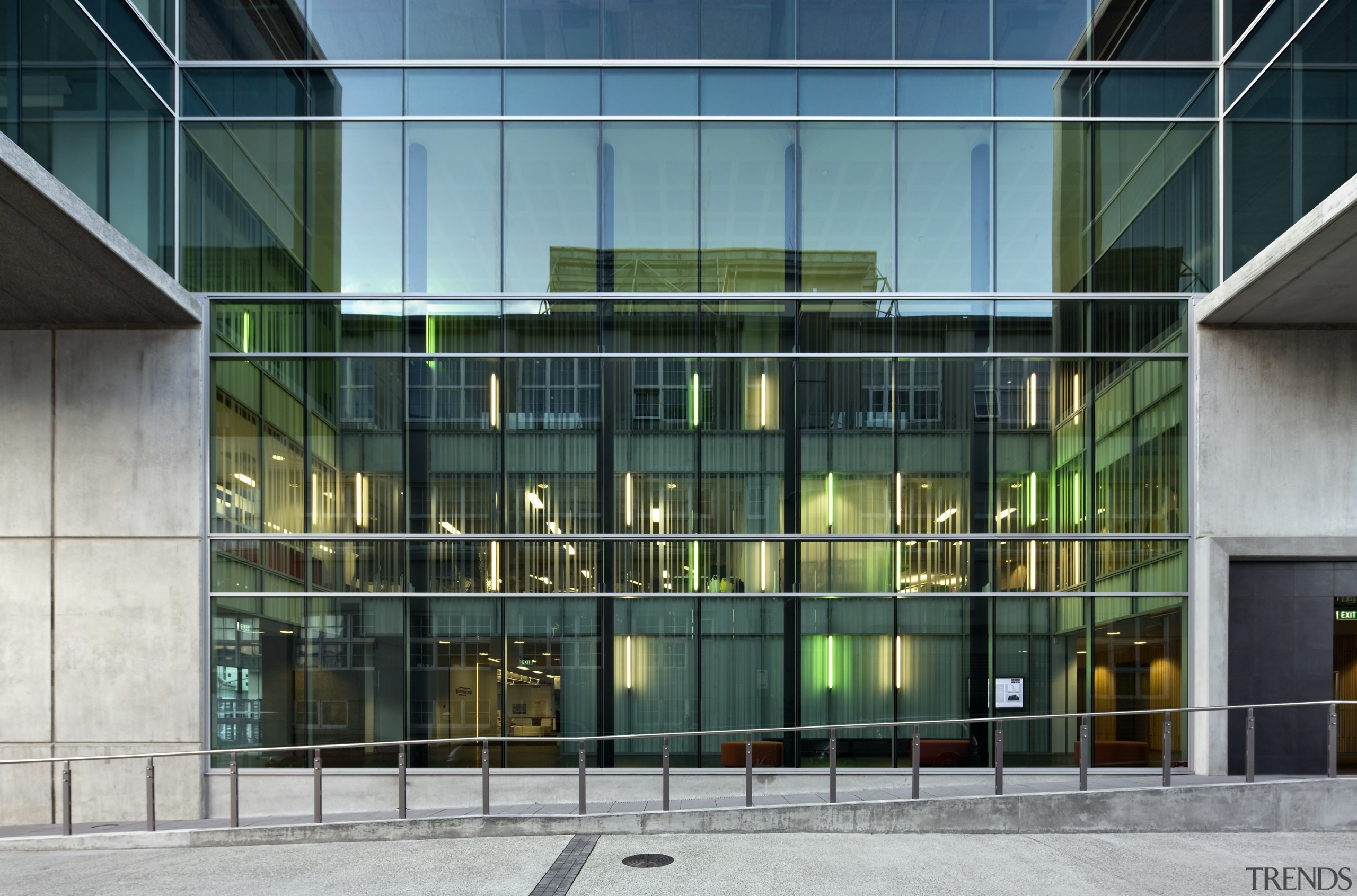 Exterior view of the side featuring large commercial architecture, building, commercial building, corporate headquarters, facade, glass, headquarters, mixed use, window, teal