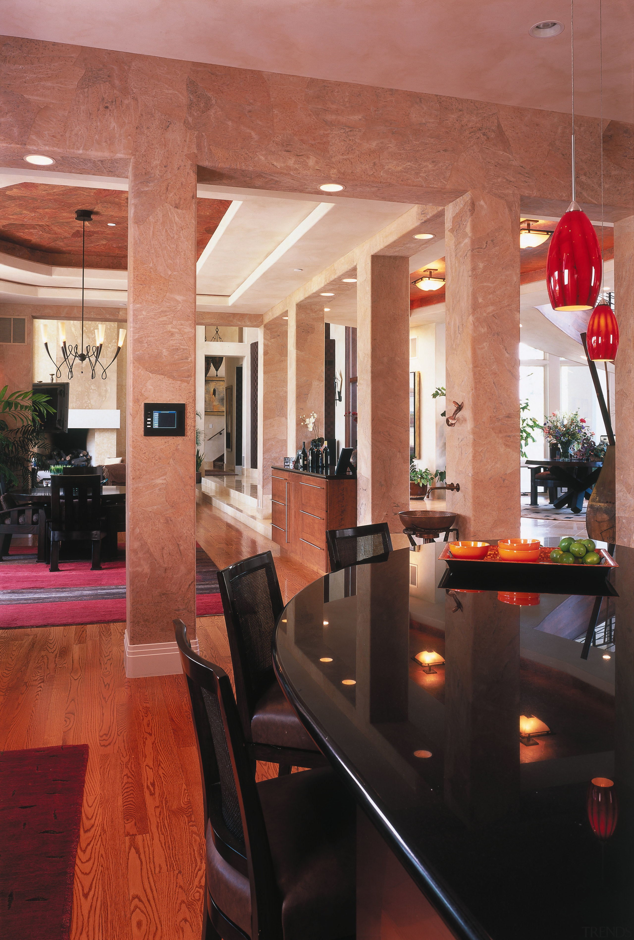 A view of the kitchen and dining areas. ceiling, dining room, floor, flooring, furniture, interior design, lobby, restaurant, room, table, red, black