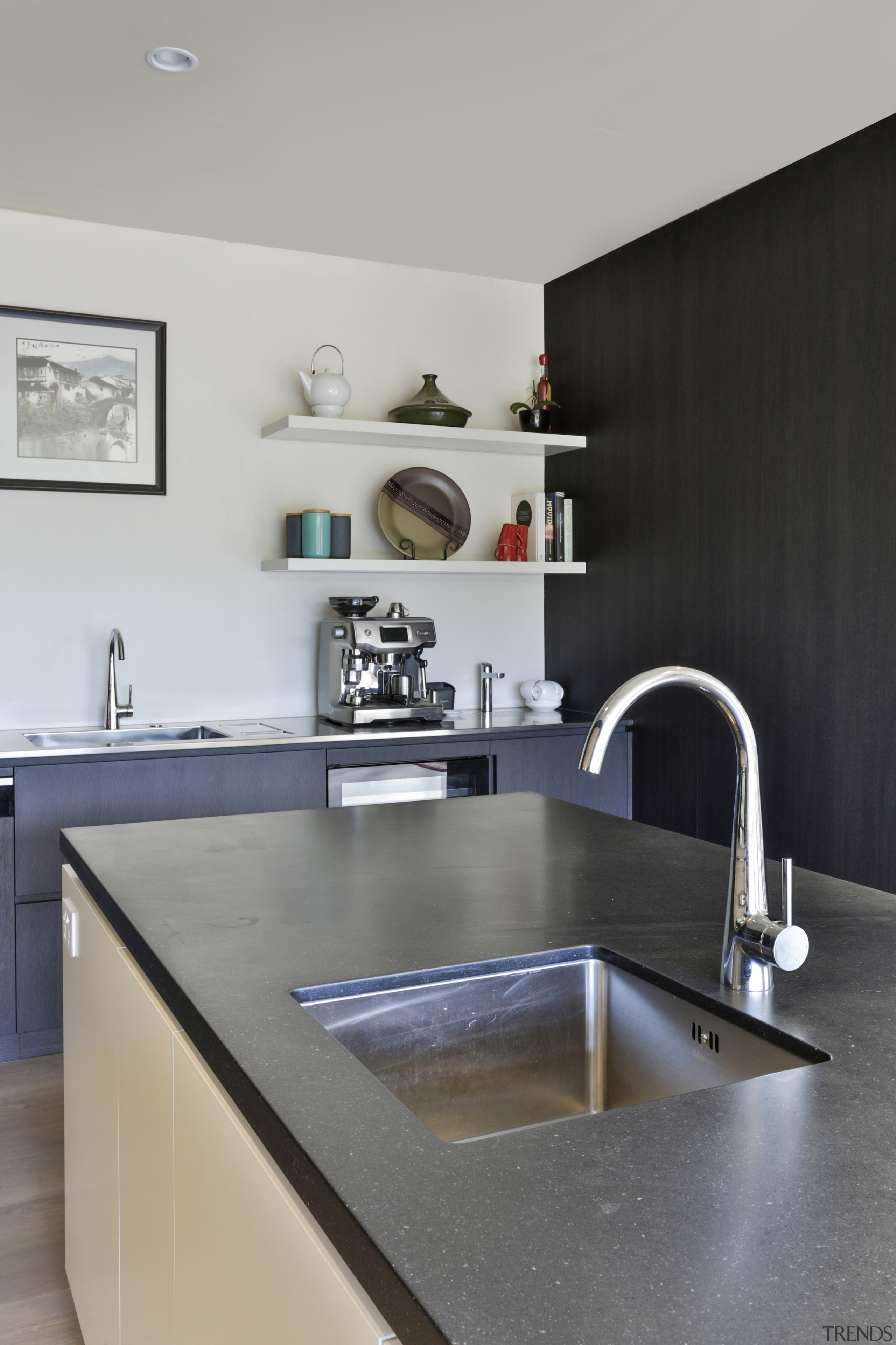 An in-island sink lets a chef prep and 