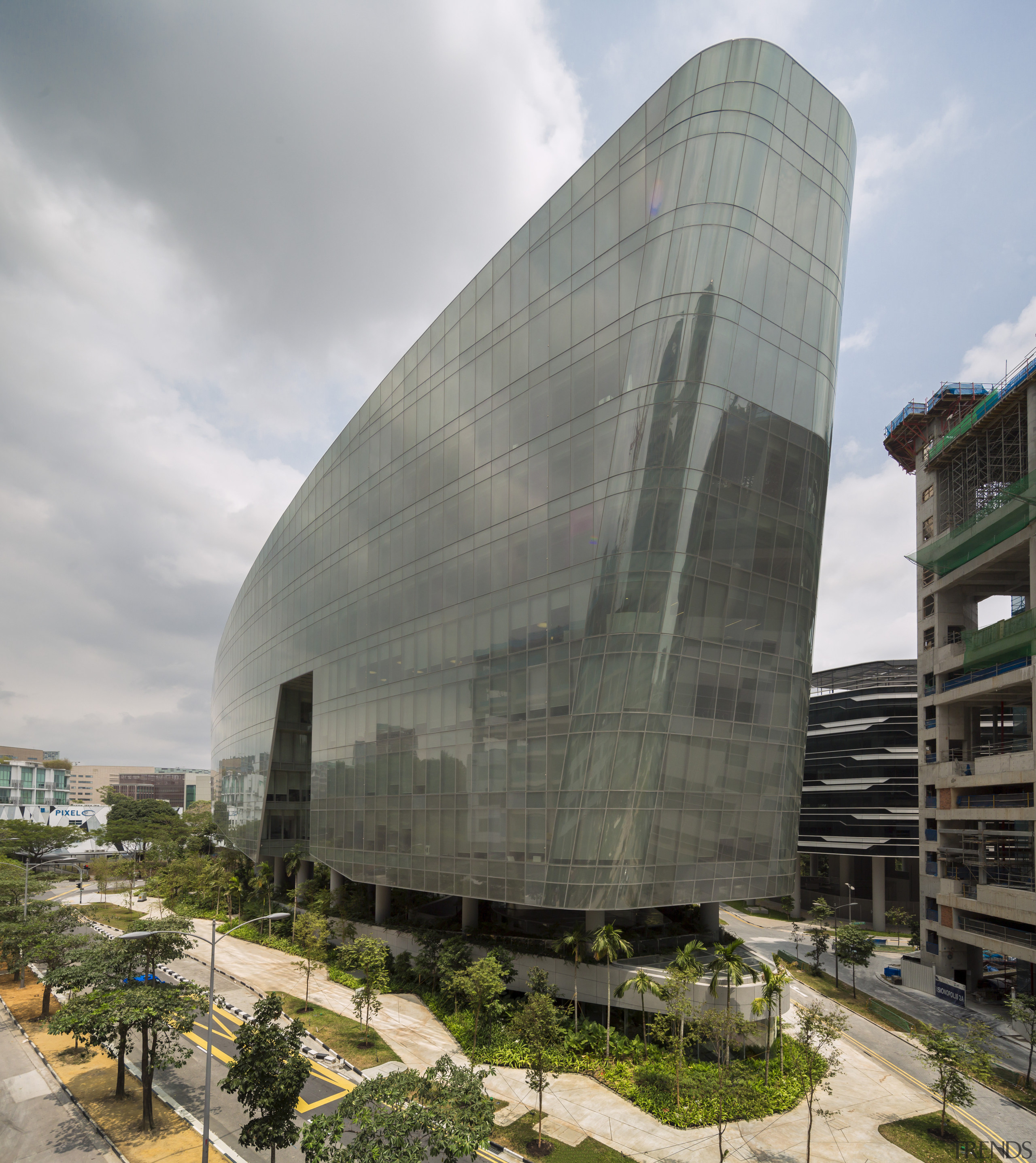 At the front, the Sandcrawler office building in architecture, building, corporate headquarters, facade, headquarters, sky, gray