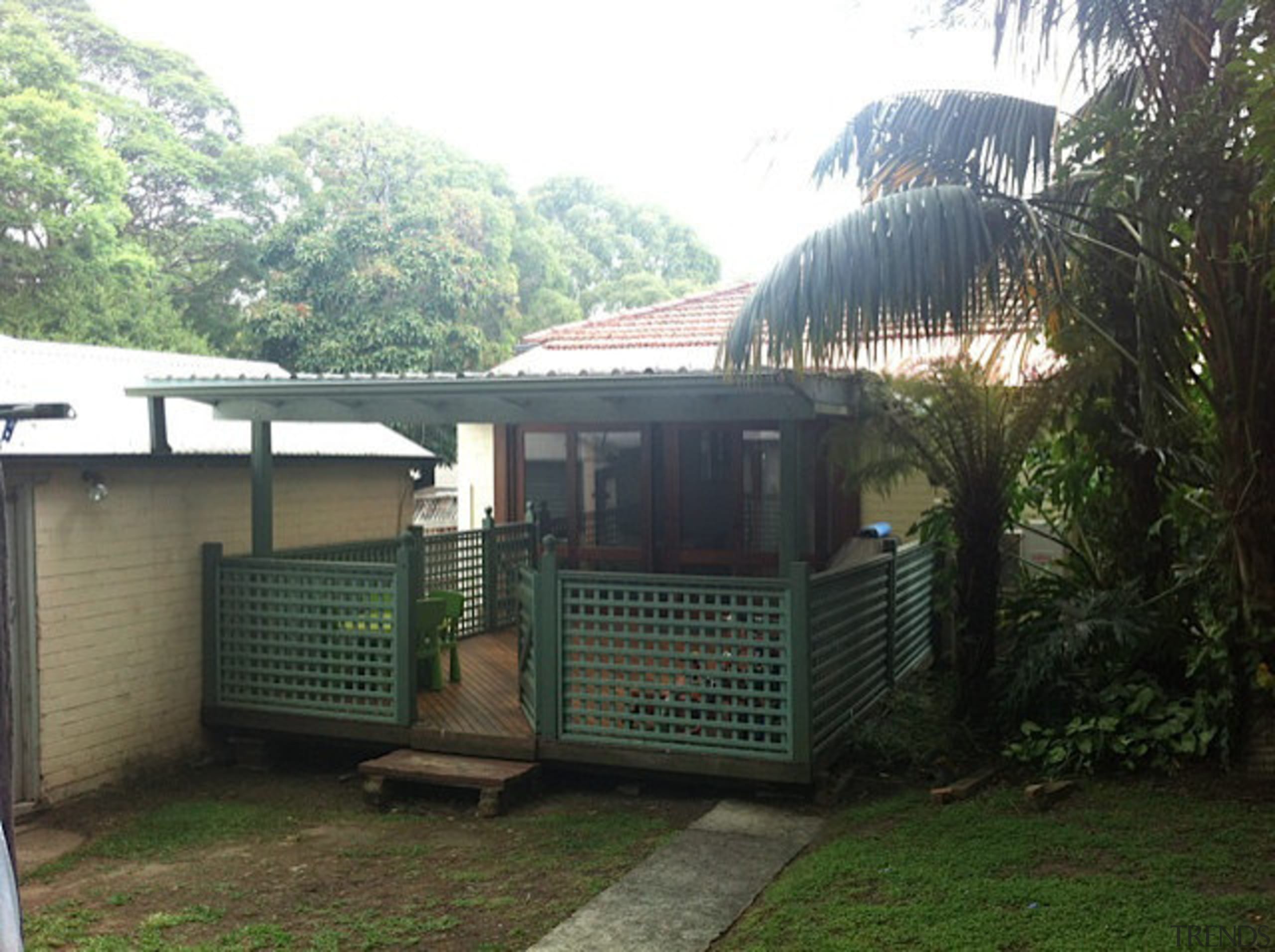 The original rear of this 1930s bungalow had area, backyard, cottage, grass, house, outdoor structure, property, real estate, roof, shed, tree, black, white