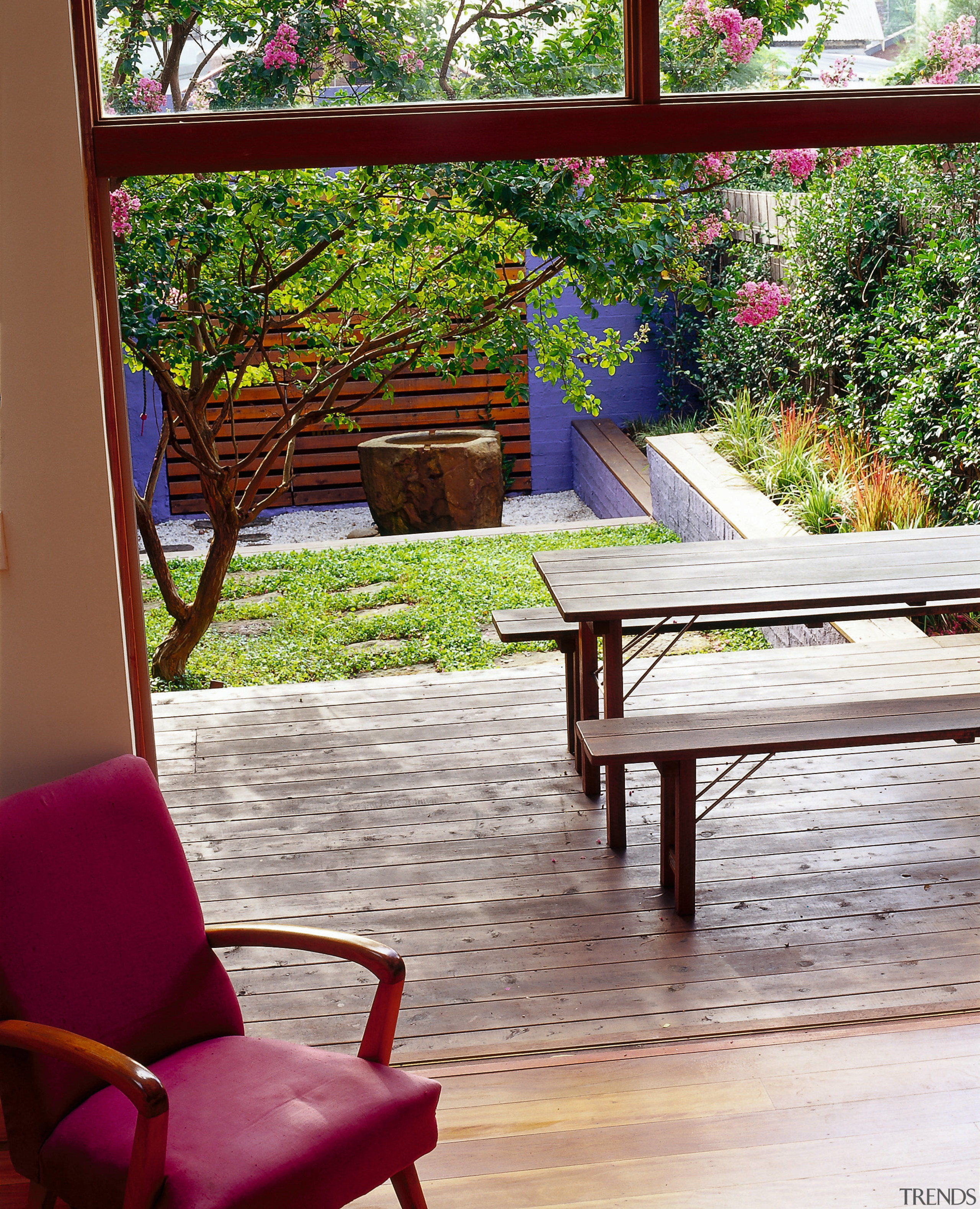 The living spaces at the rear of the backyard, chair, deck, furniture, home, house, outdoor furniture, outdoor structure, plant, table, tree, window, wood