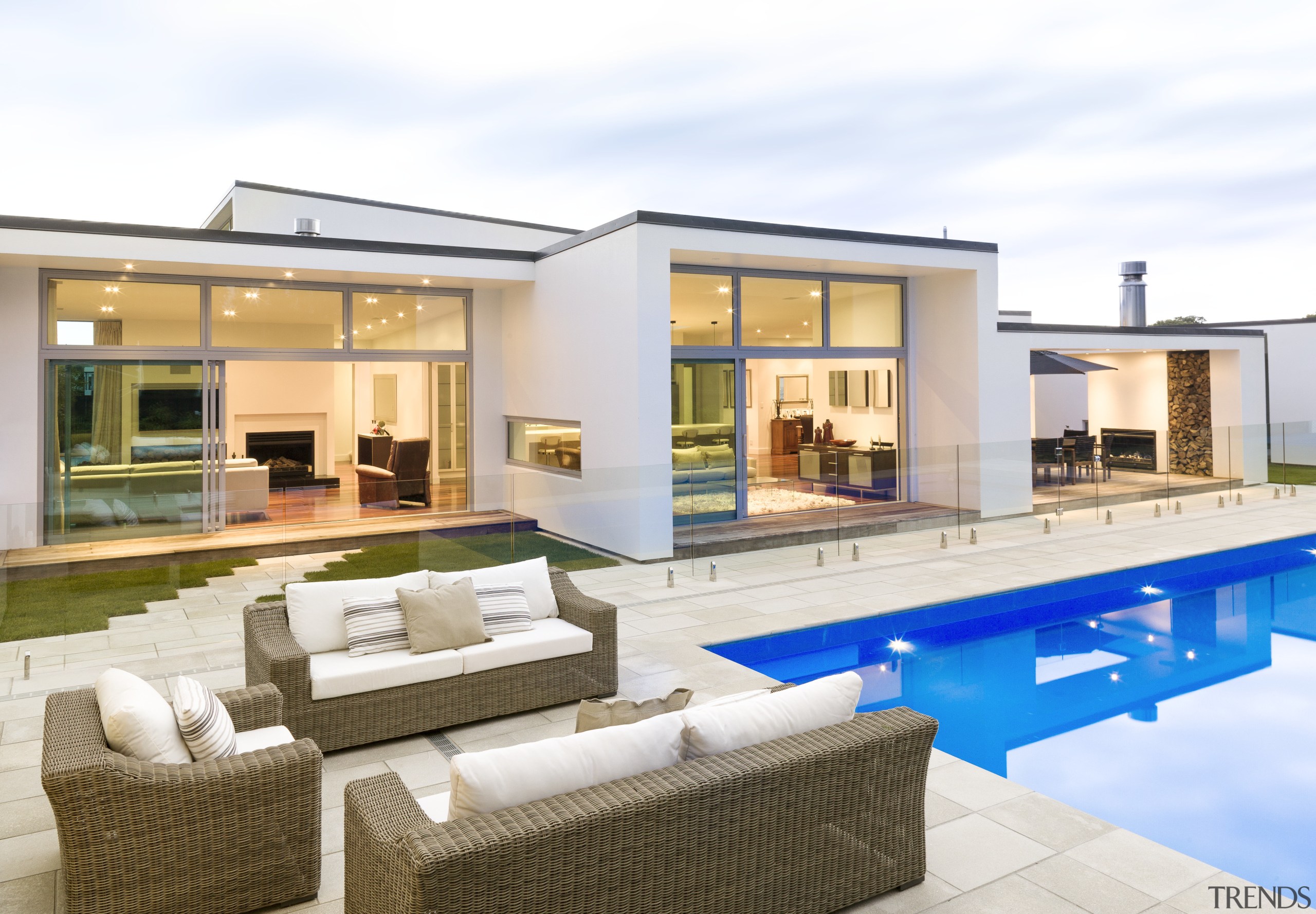 Modern family home with outdoor seating area. Aluminium apartment, estate, home, house, interior design, property, real estate, swimming pool, villa, window, white