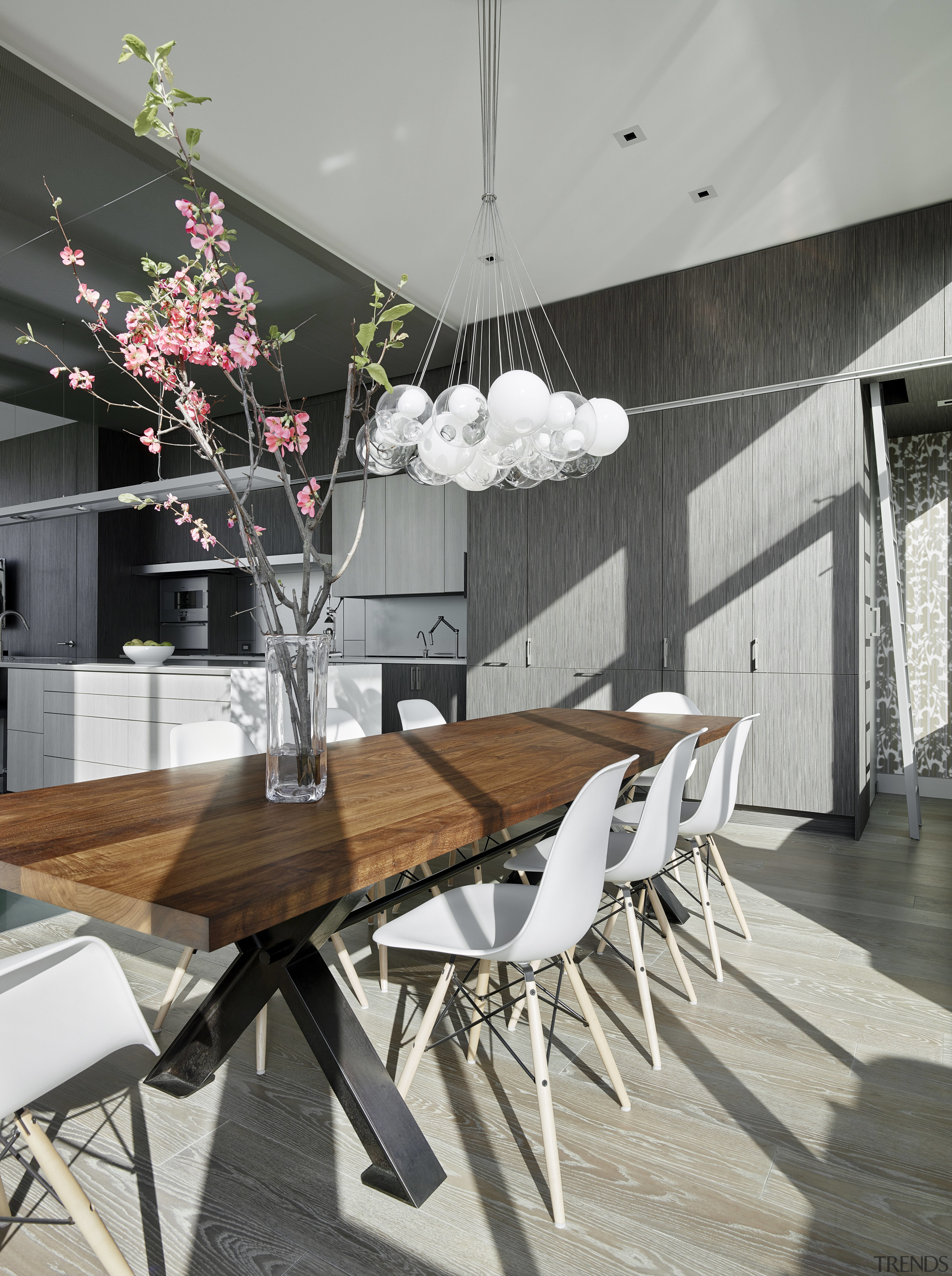 Cabinets beside the dining area hide a powder architecture, chair, dining room, furniture, home, house, interior design, table, gray