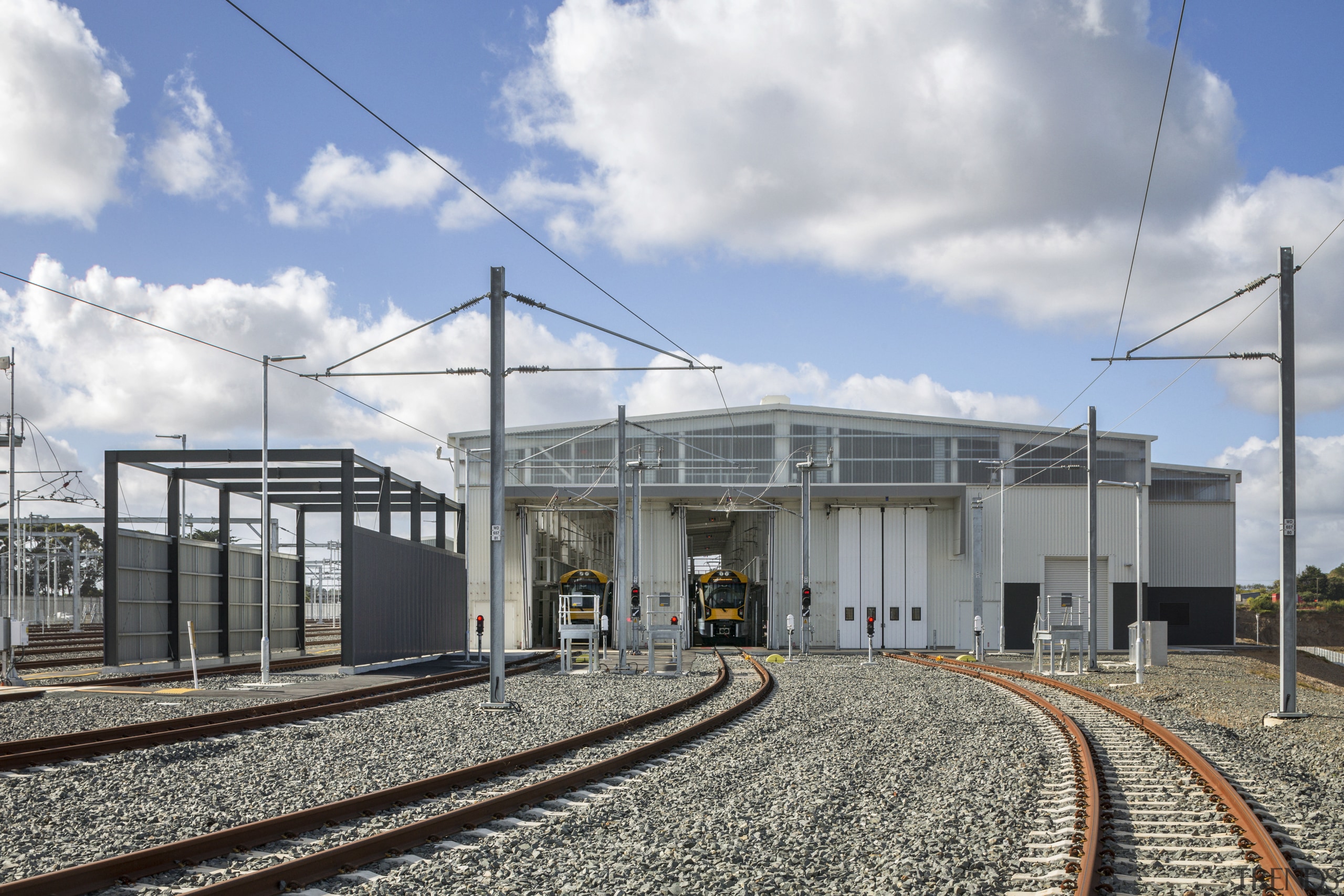 A remotely controlled points system is operated from sky, track, train station, transport, white, gray