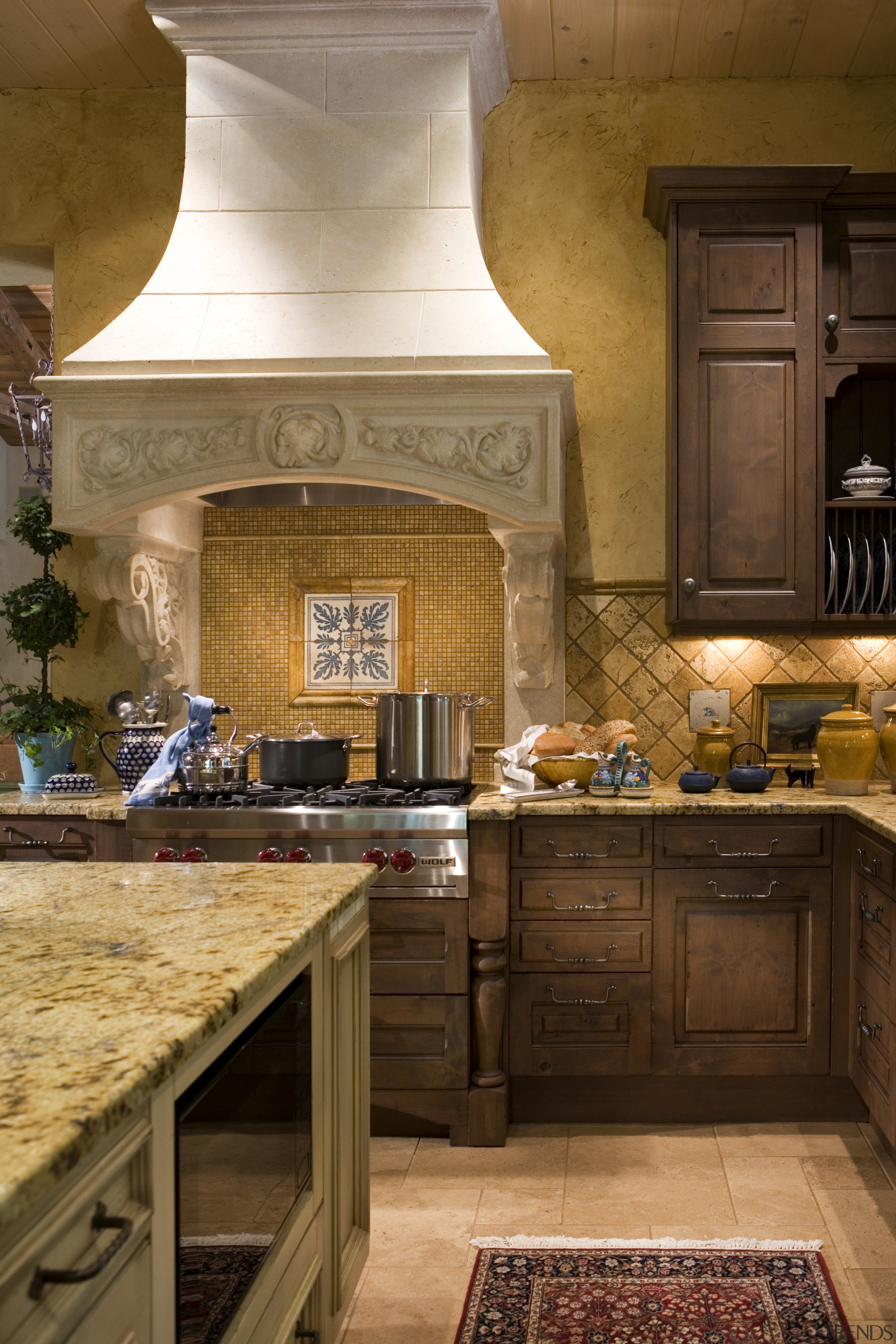 View of kitchen featuring cabinetry, granite countertops, sinks, cabinetry, countertop, cuisine classique, flooring, home, interior design, kitchen, room, brown