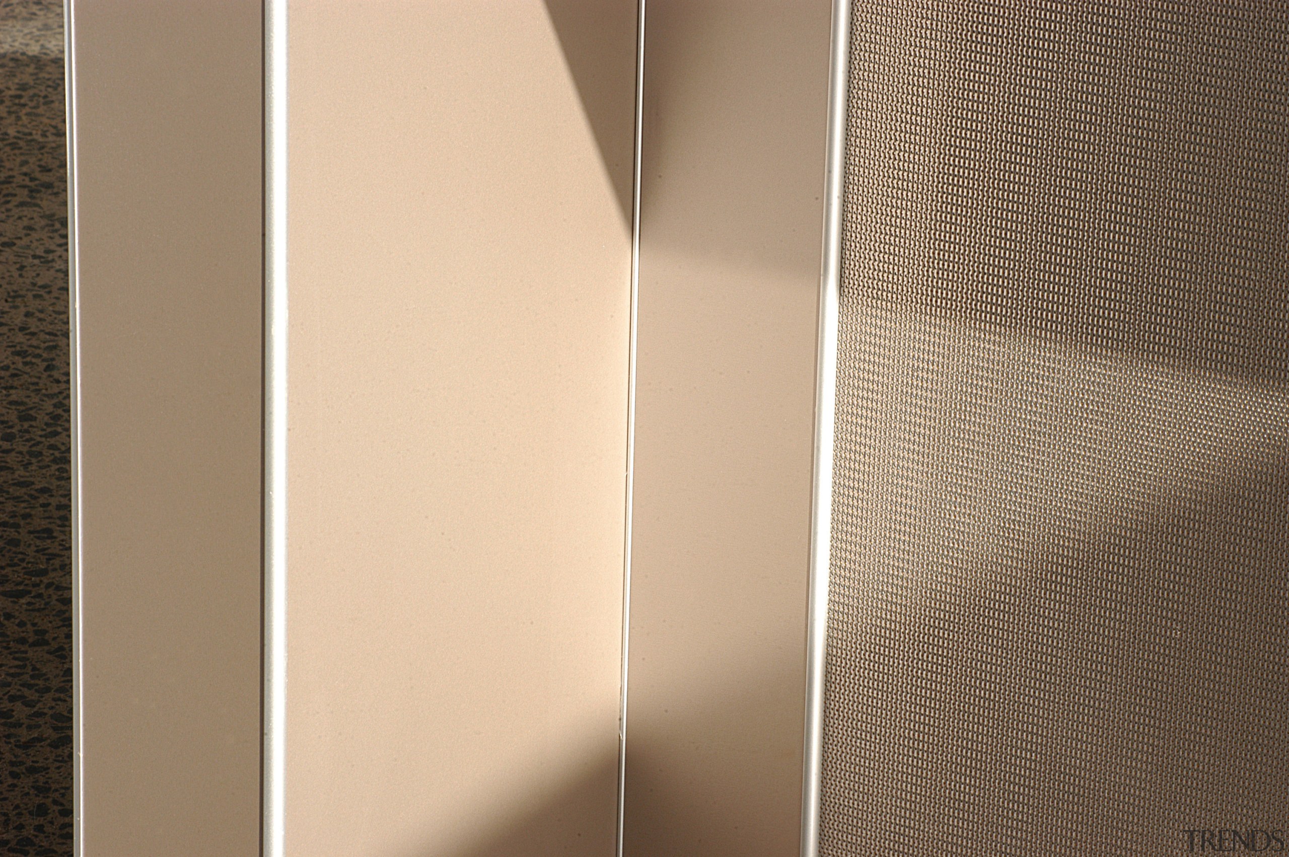 View of textured laminate panels used in kitchen lighting, product design, wood, orange, brown