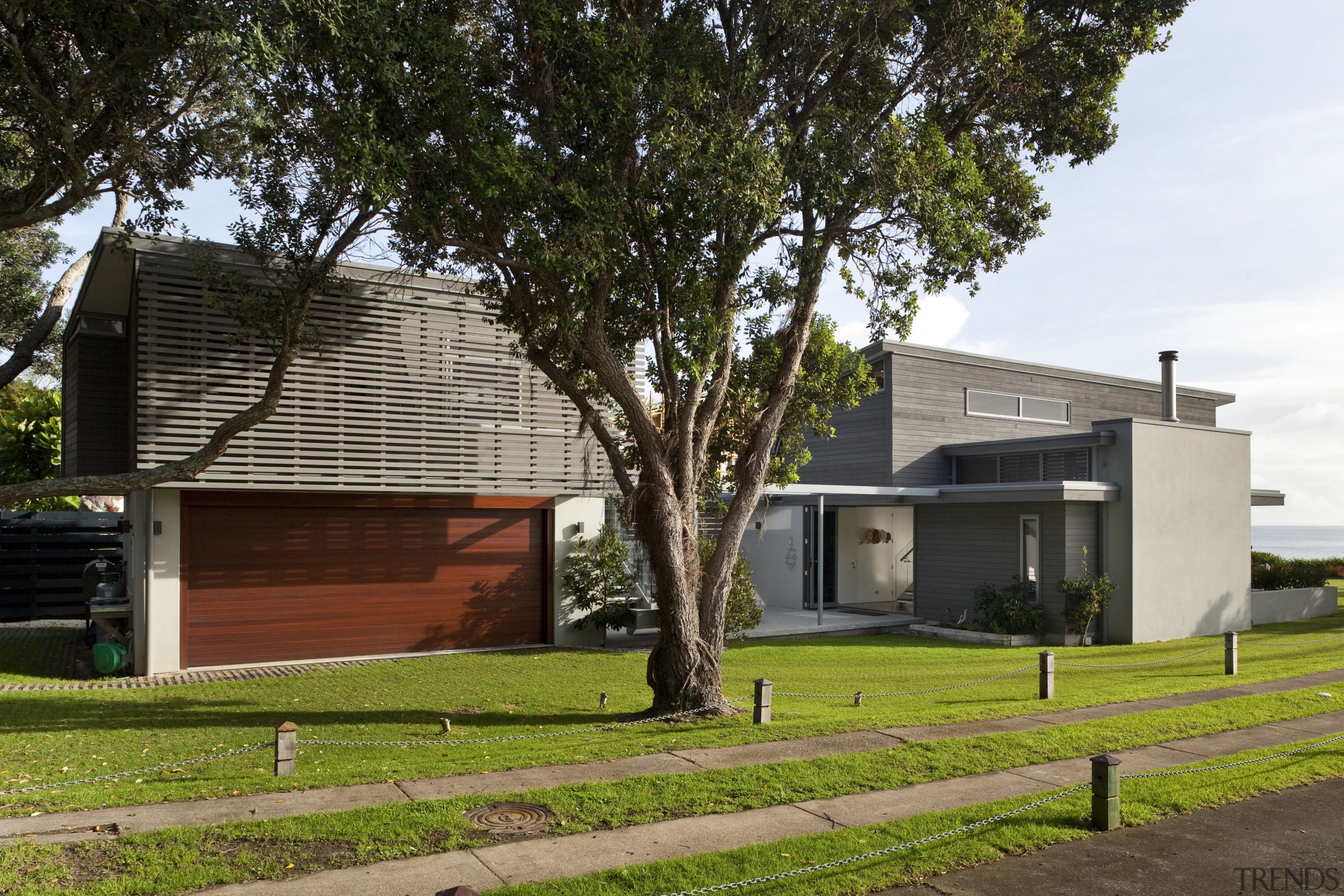 This house was designed by Hamish Cameron NZIA architecture, building, cottage, facade, home, house, neighbourhood, property, real estate, residential area, tree, brown