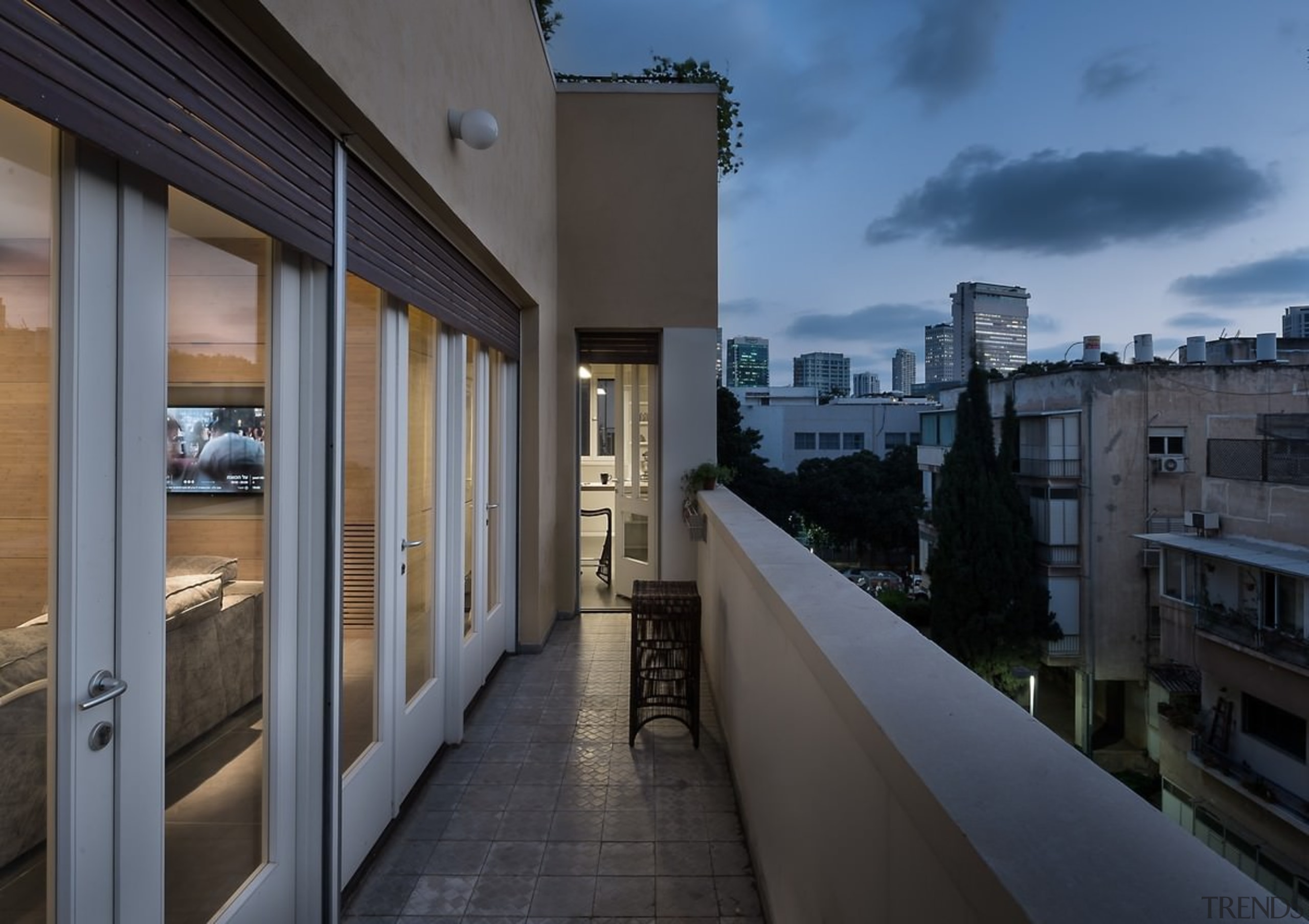 A narrow balcony provides expansive city views - apartment, architecture, building, condominium, home, house, property, real estate, sky, window, black