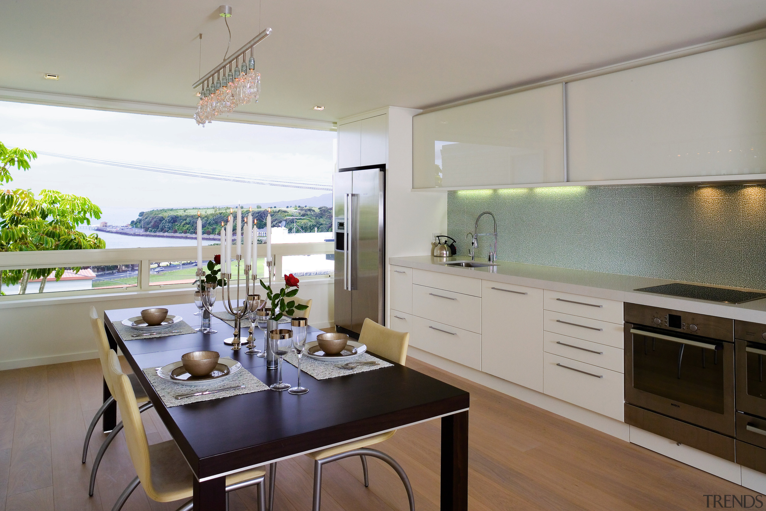 A view of the kitchen and dining areas, countertop, cuisine classique, interior design, kitchen, real estate, room, gray