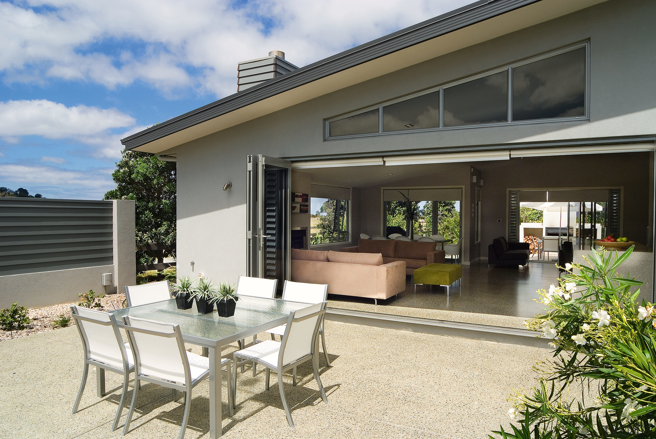 A view of a home by GJ Gadiner estate, home, house, outdoor structure, patio, property, real estate, window, gray