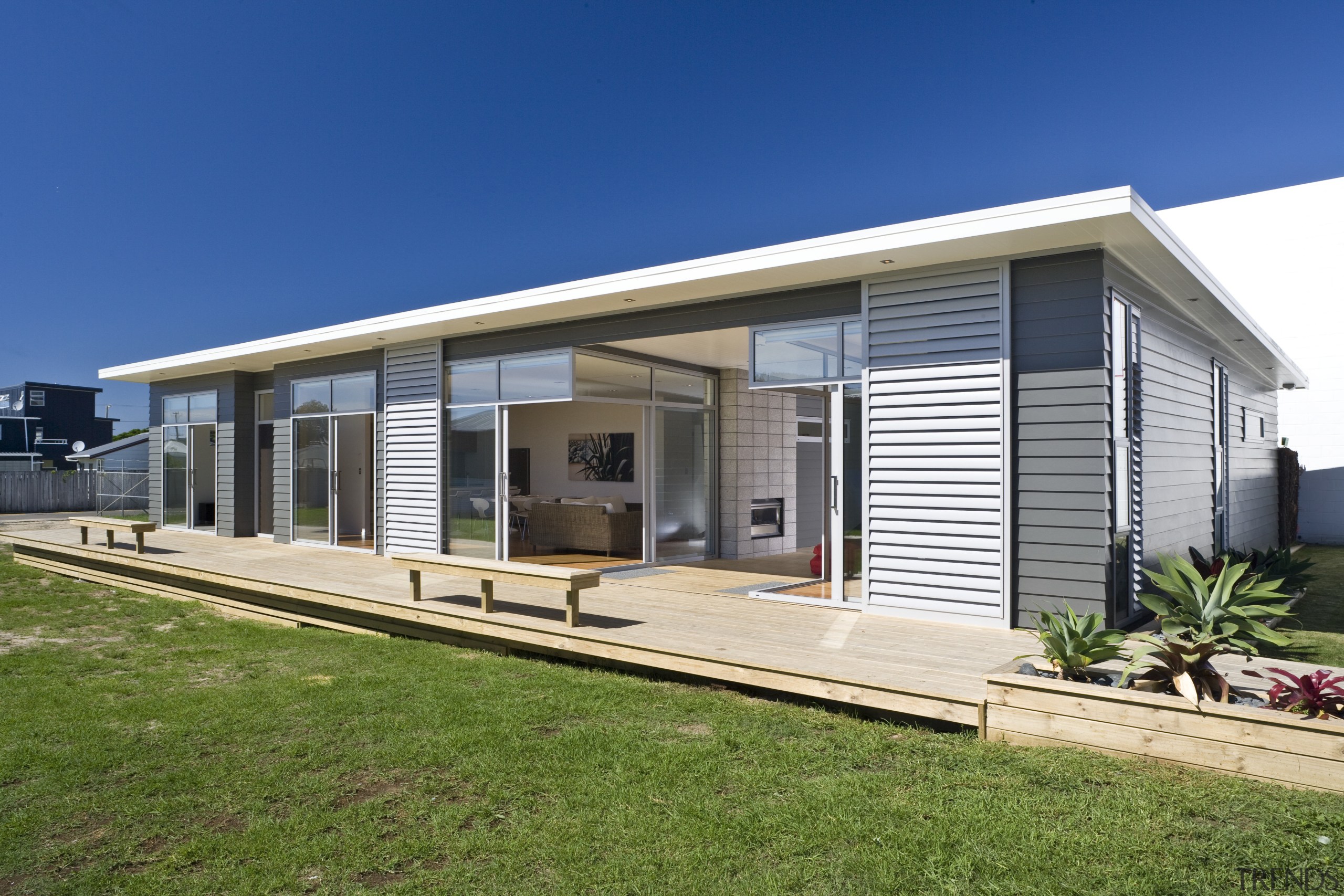 Exterior view of a future-proof Jennian Homes show architecture, elevation, facade, home, house, property, real estate, residential area, siding, blue