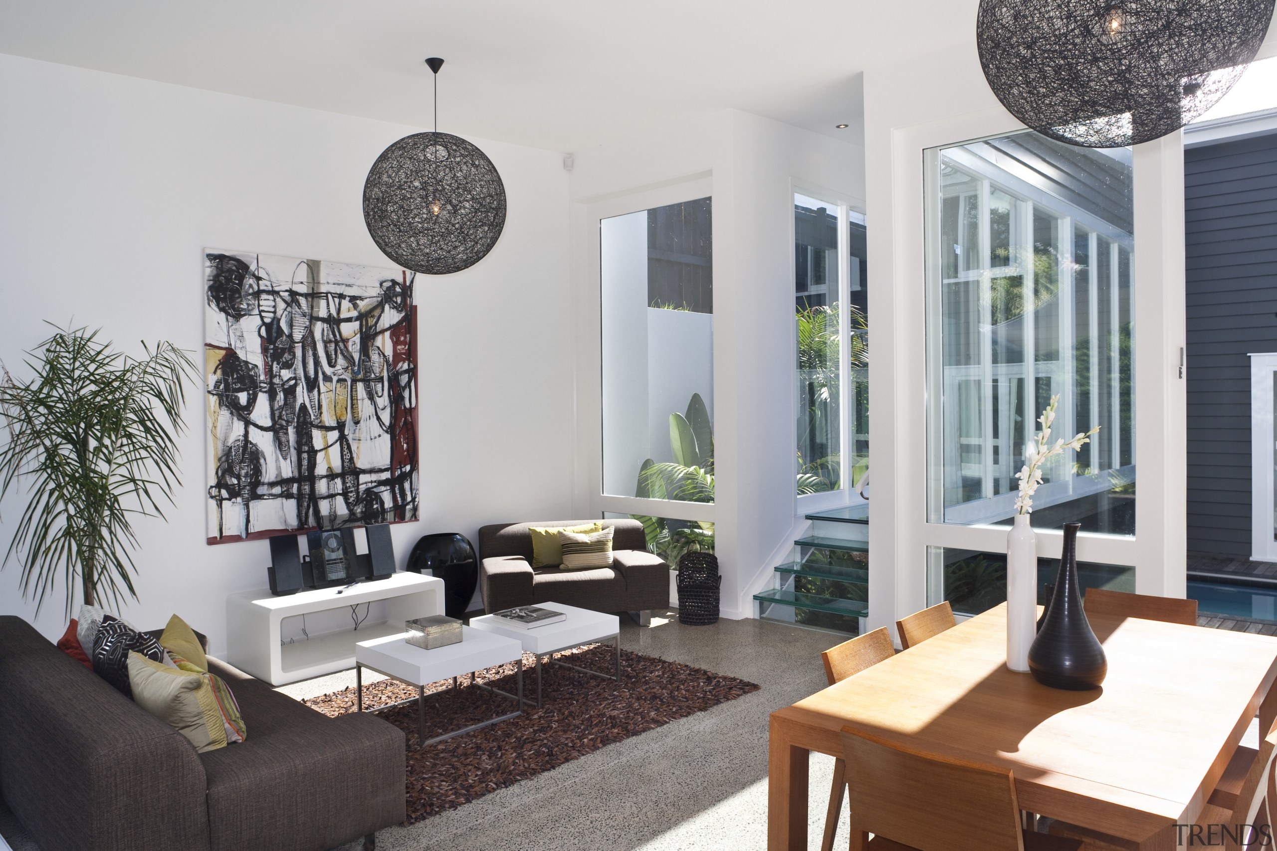 View of this modern home - View of furniture, home, interior design, living room, real estate, room, table, white, gray