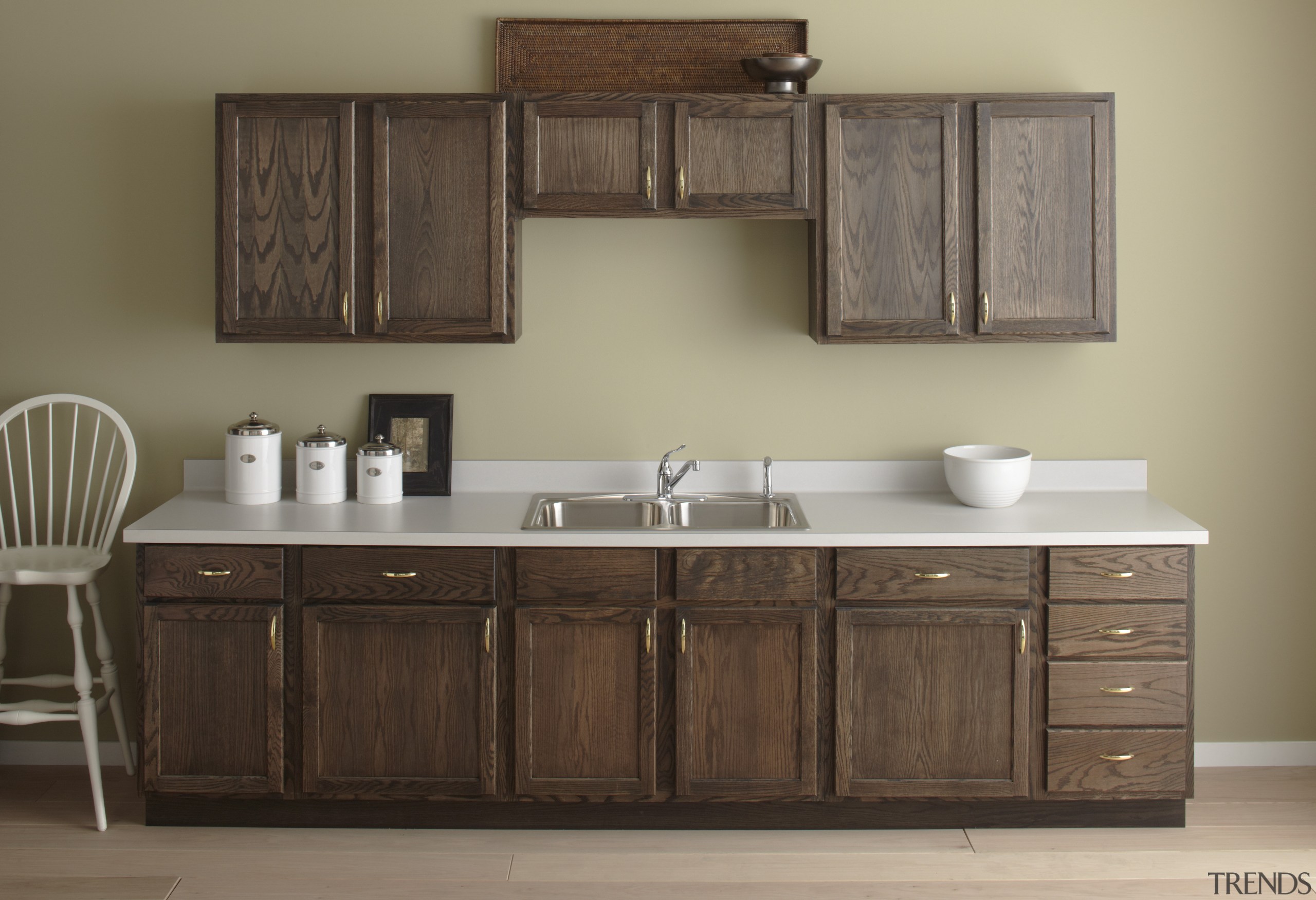 Seen here is a kitchen with a Kohler bathroom, bathroom accessory, bathroom cabinet, cabinetry, chest of drawers, countertop, cuisine classique, furniture, hardwood, kitchen, product design, sink, wood stain, brown