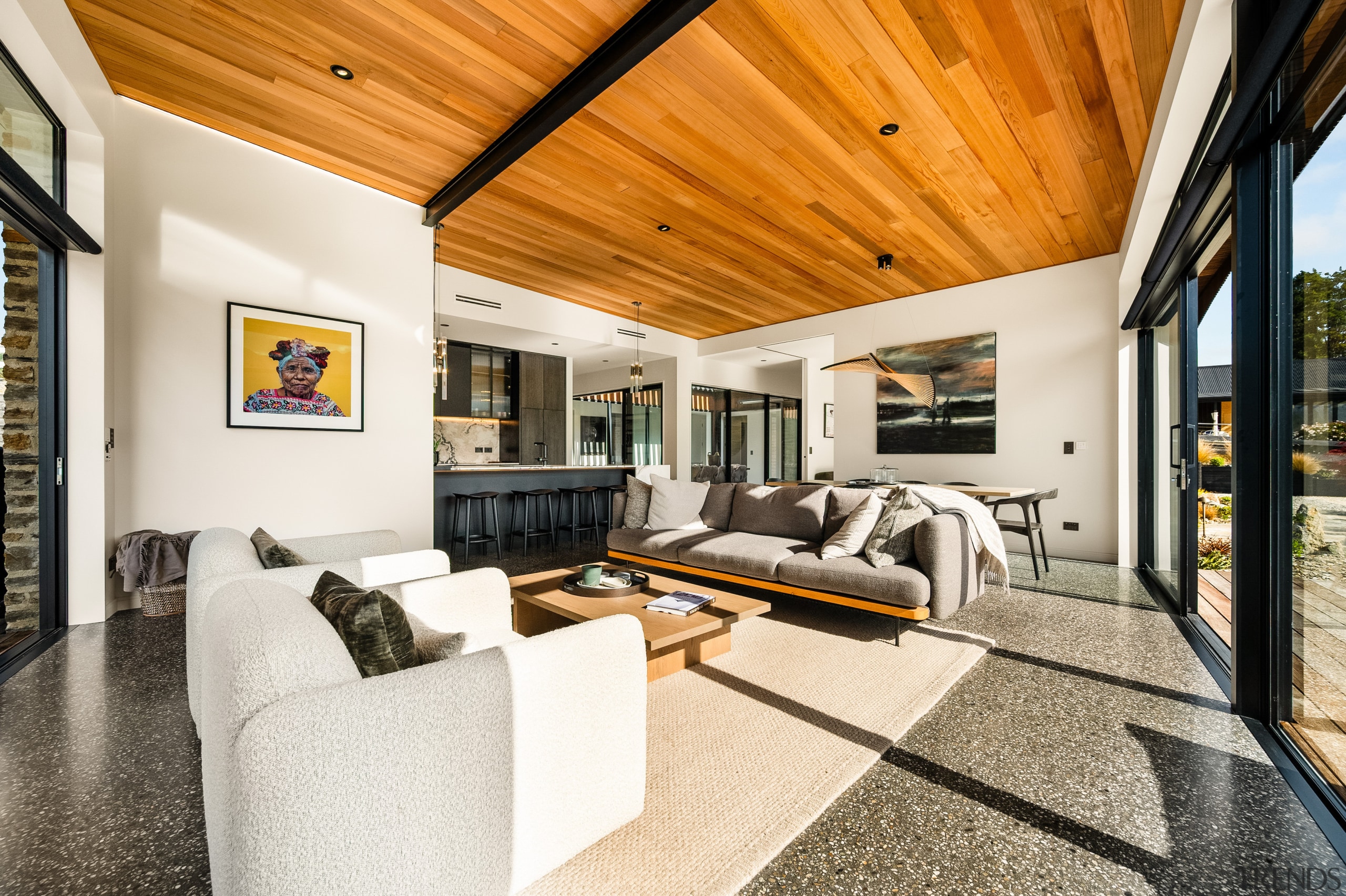 Rich timber ceiling overhead and concrete floors below 
