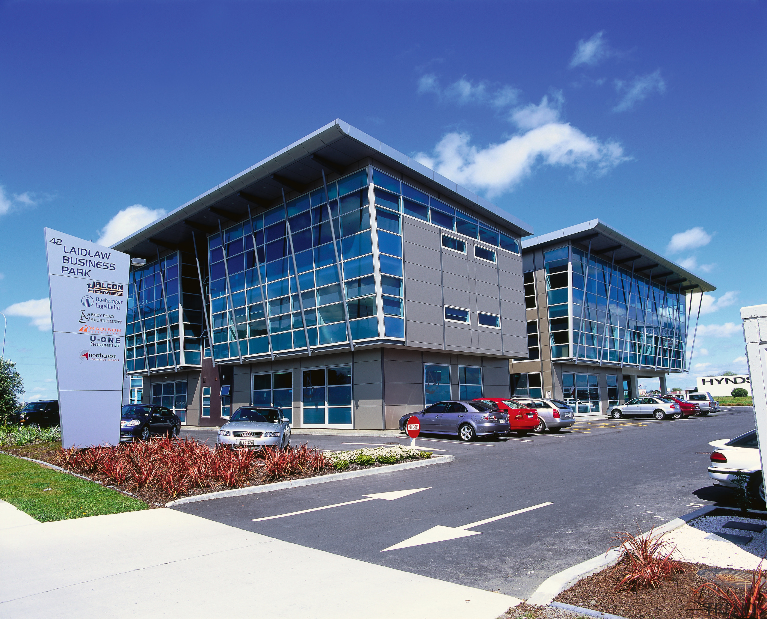 A view of the Jalcon homes building. - apartment, architecture, building, commercial building, condominium, corporate headquarters, daytime, elevation, facade, headquarters, metropolitan area, mixed use, property, real estate, residential area, sky, blue