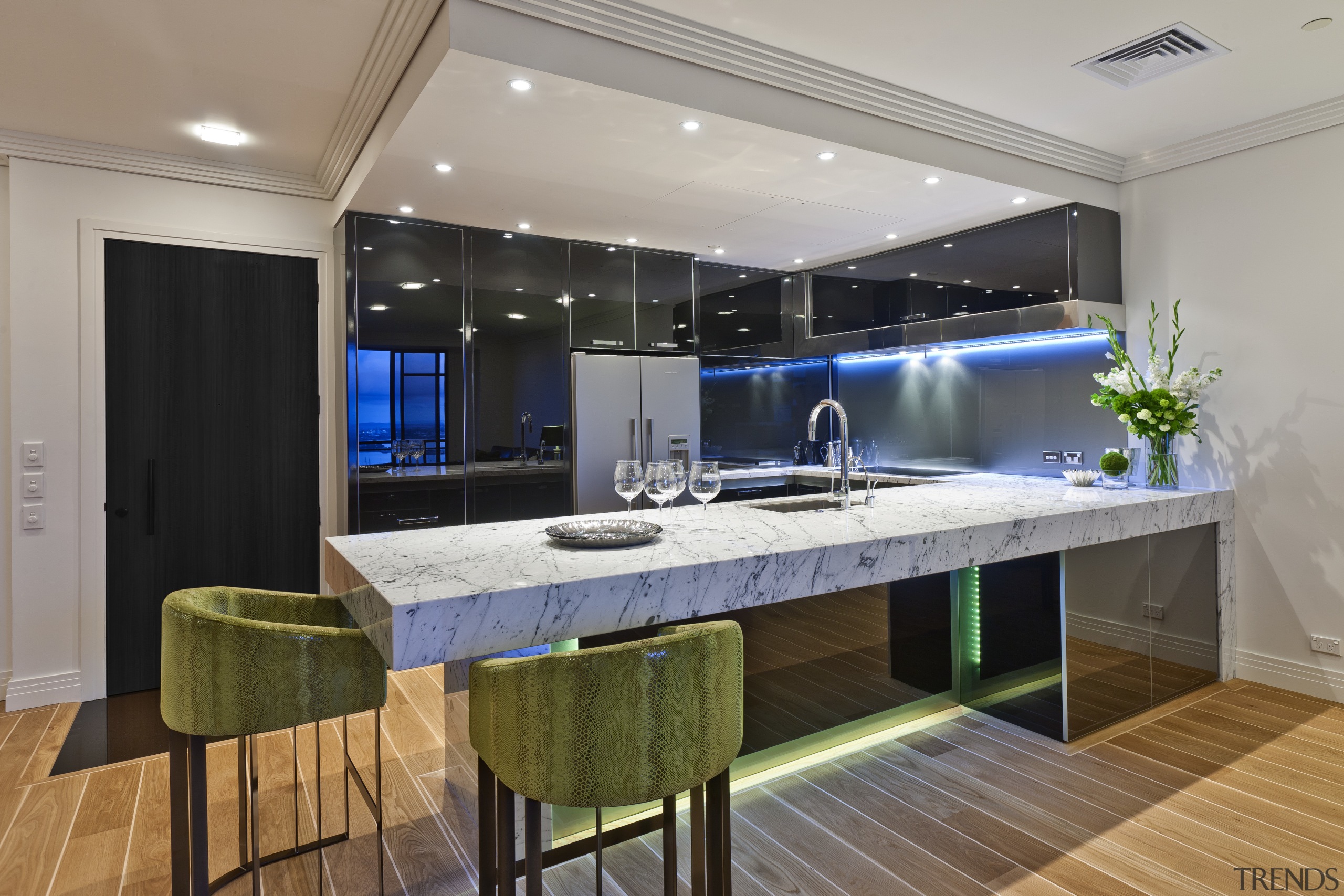 View of apartment kitchen with black glass cabinetry, countertop, interior design, kitchen, real estate, gray