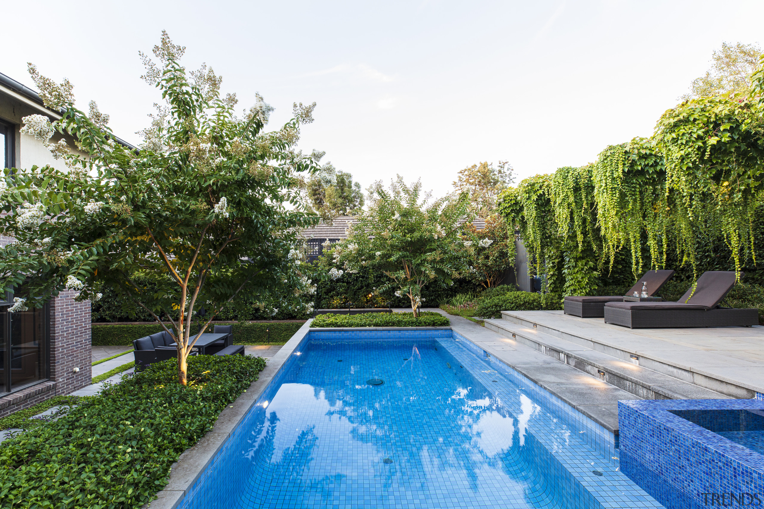 The pergola runs alongside the pool. - Hanging 