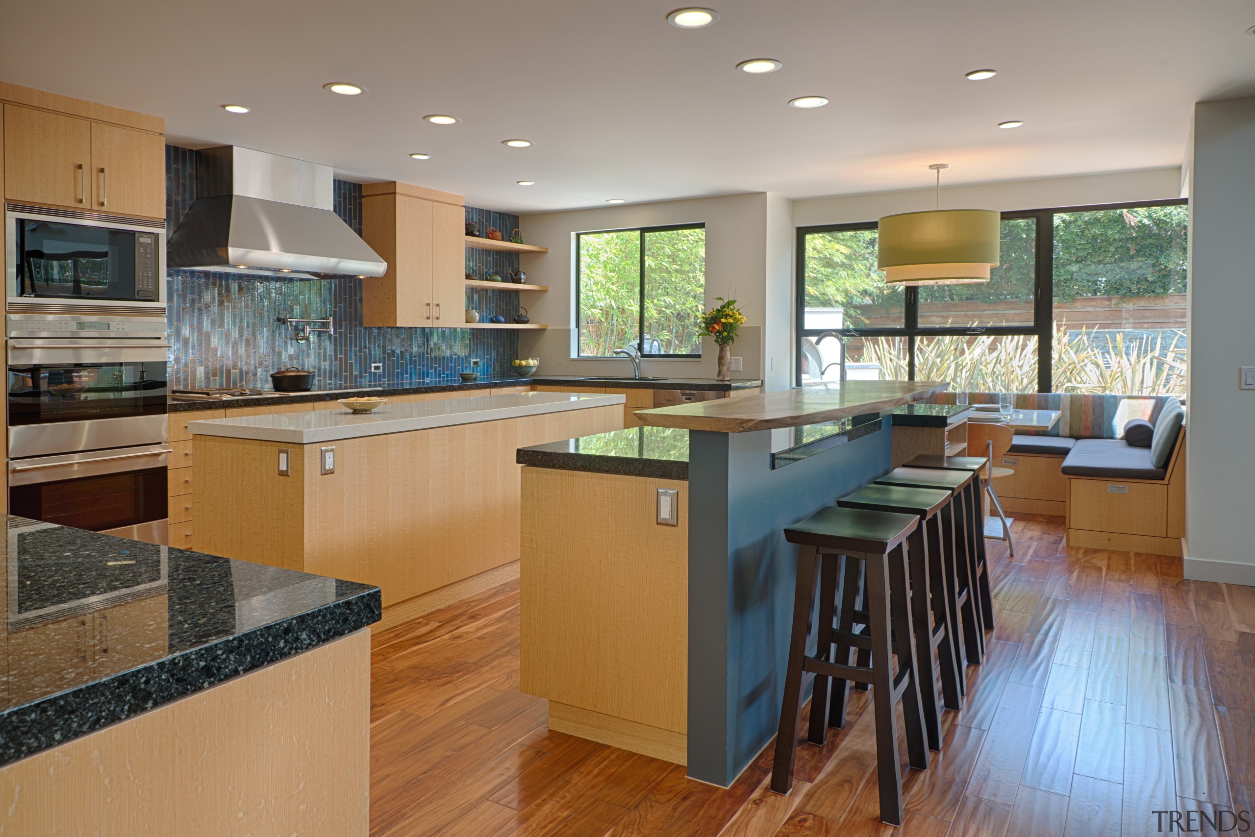 This spacious kitchen is part of a large, cabinetry, countertop, floor, flooring, hardwood, interior design, kitchen, real estate, room, wood flooring, gray