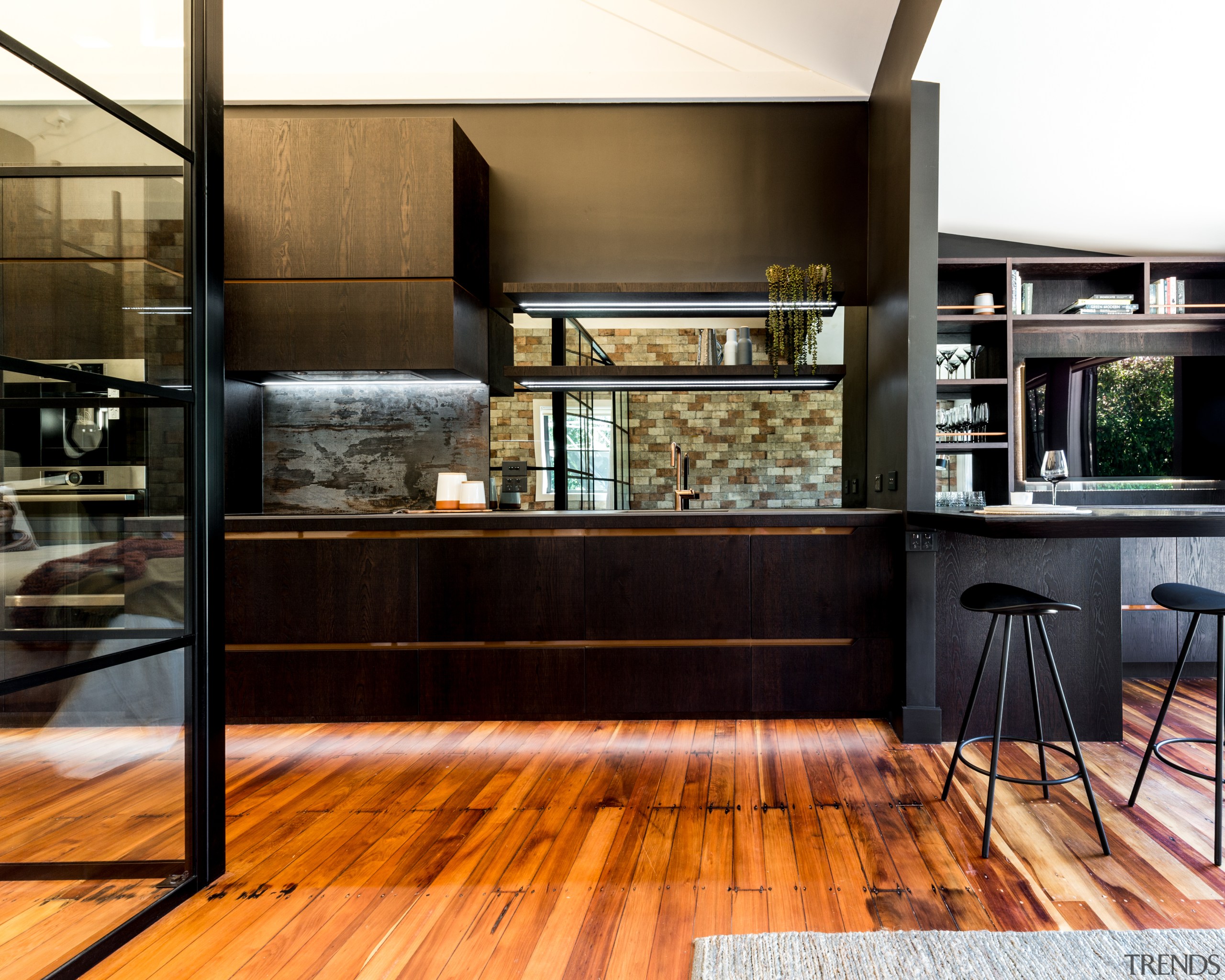 ​​​​​​​An antique mirror splashback gives way to a black