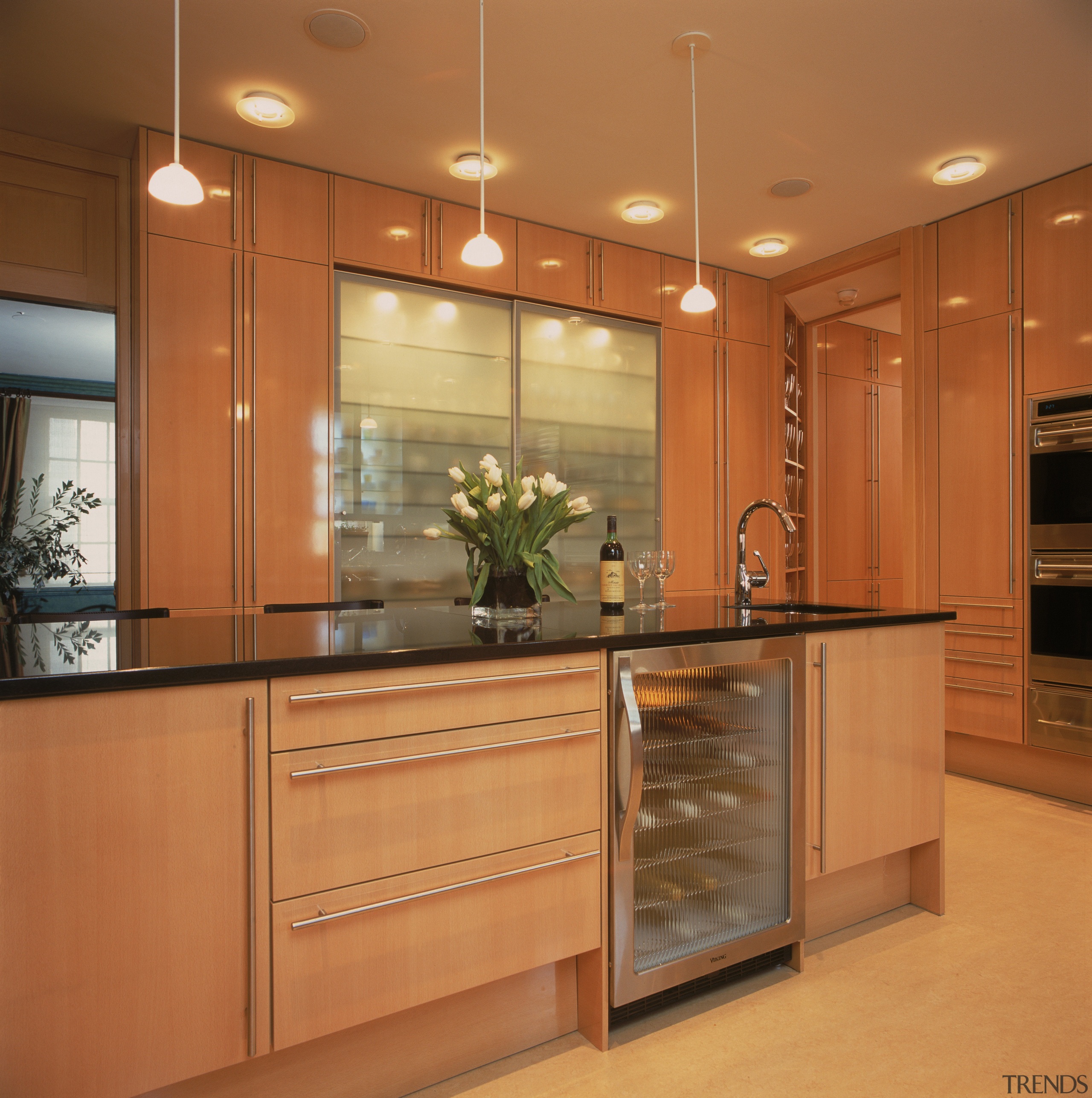 View of remodeled kitchen in a Park Avenue cabinetry, countertop, cuisine classique, hardwood, interior design, kitchen, room, under cabinet lighting, orange, brown