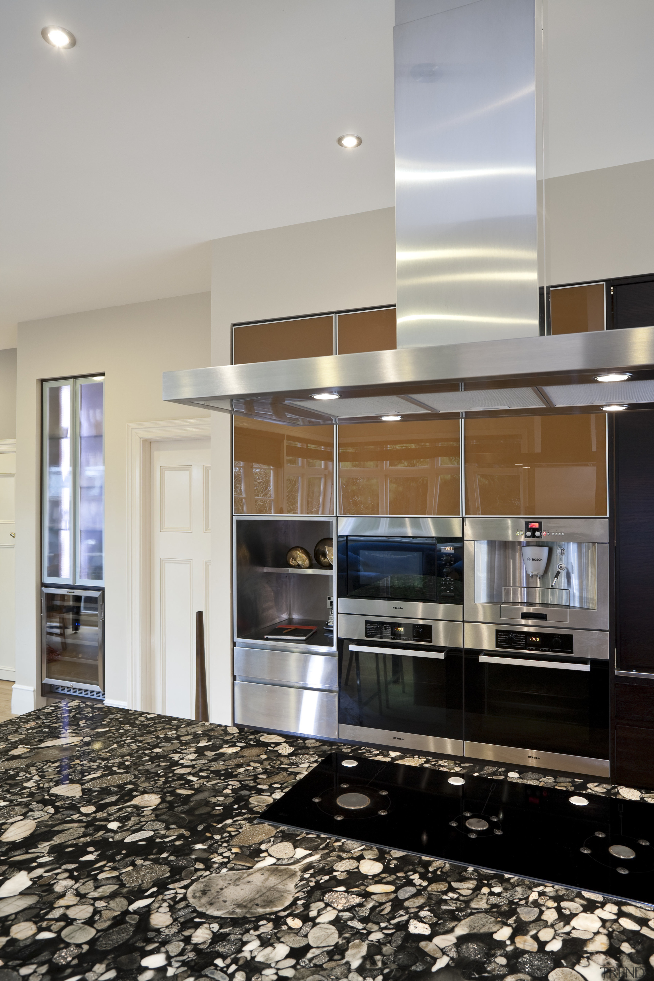 So this area looks good even when the ceiling, countertop, flooring, interior design, kitchen, gray, black