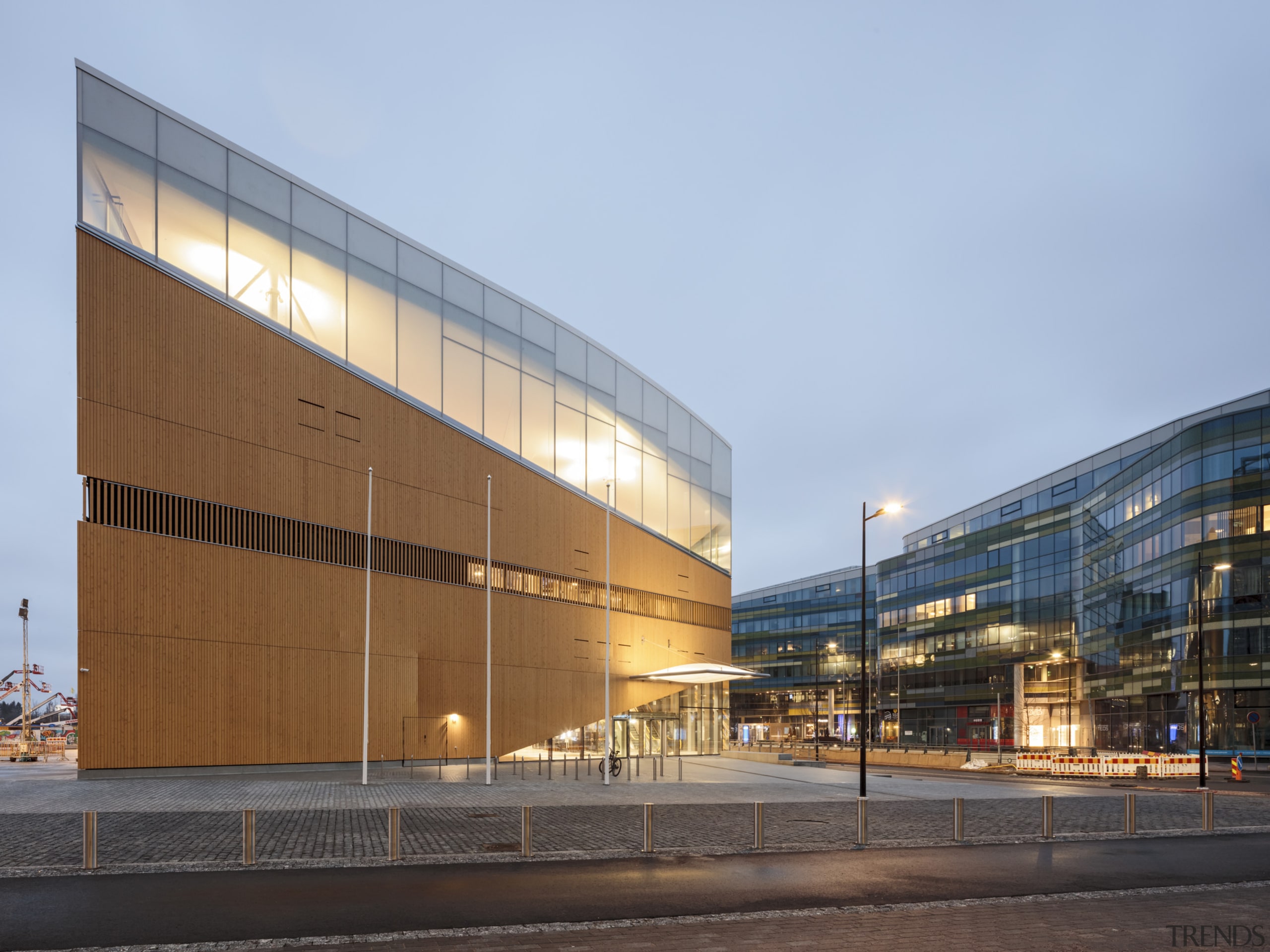 The artistic Helsinki library is a giant magnet architecture, building, city, commercial building, corporate headquarters, facade, headquarters, metropolitan area, mixed-use, sky, teal