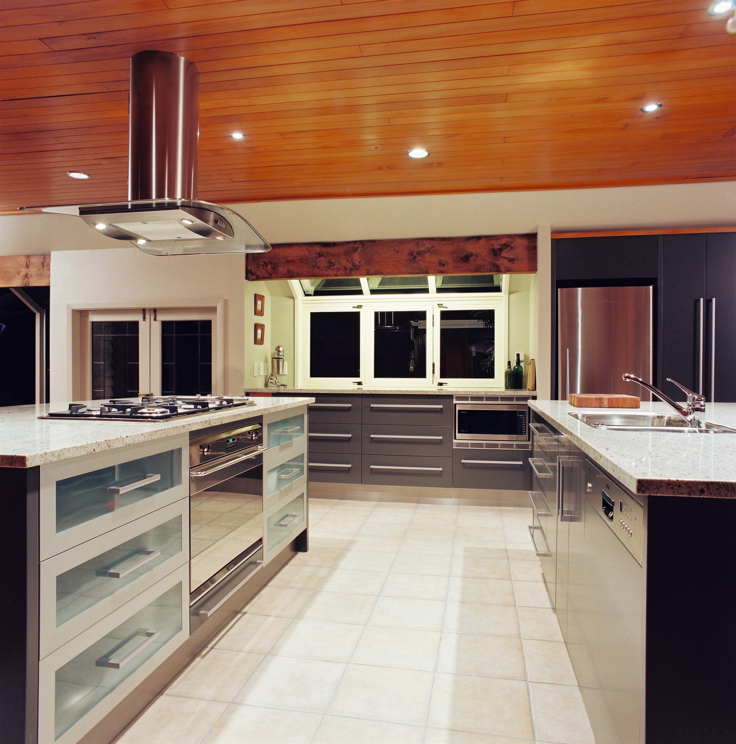 A viewof a kitchen area, cream tiled floor, cabinetry, ceiling, countertop, cuisine classique, floor, flooring, hardwood, interior design, kitchen, room, wood flooring, gray