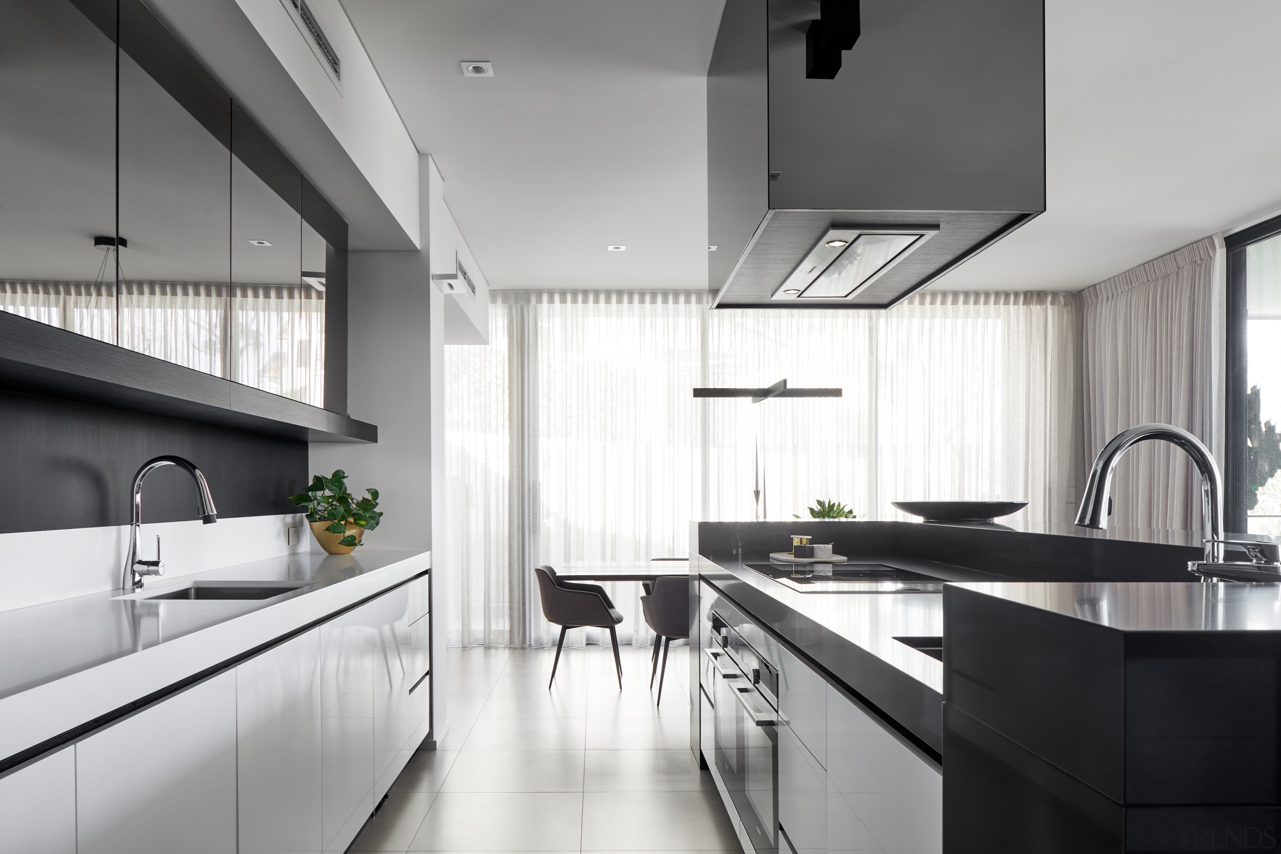 The minimalist kitchen features strong, simple forms. 