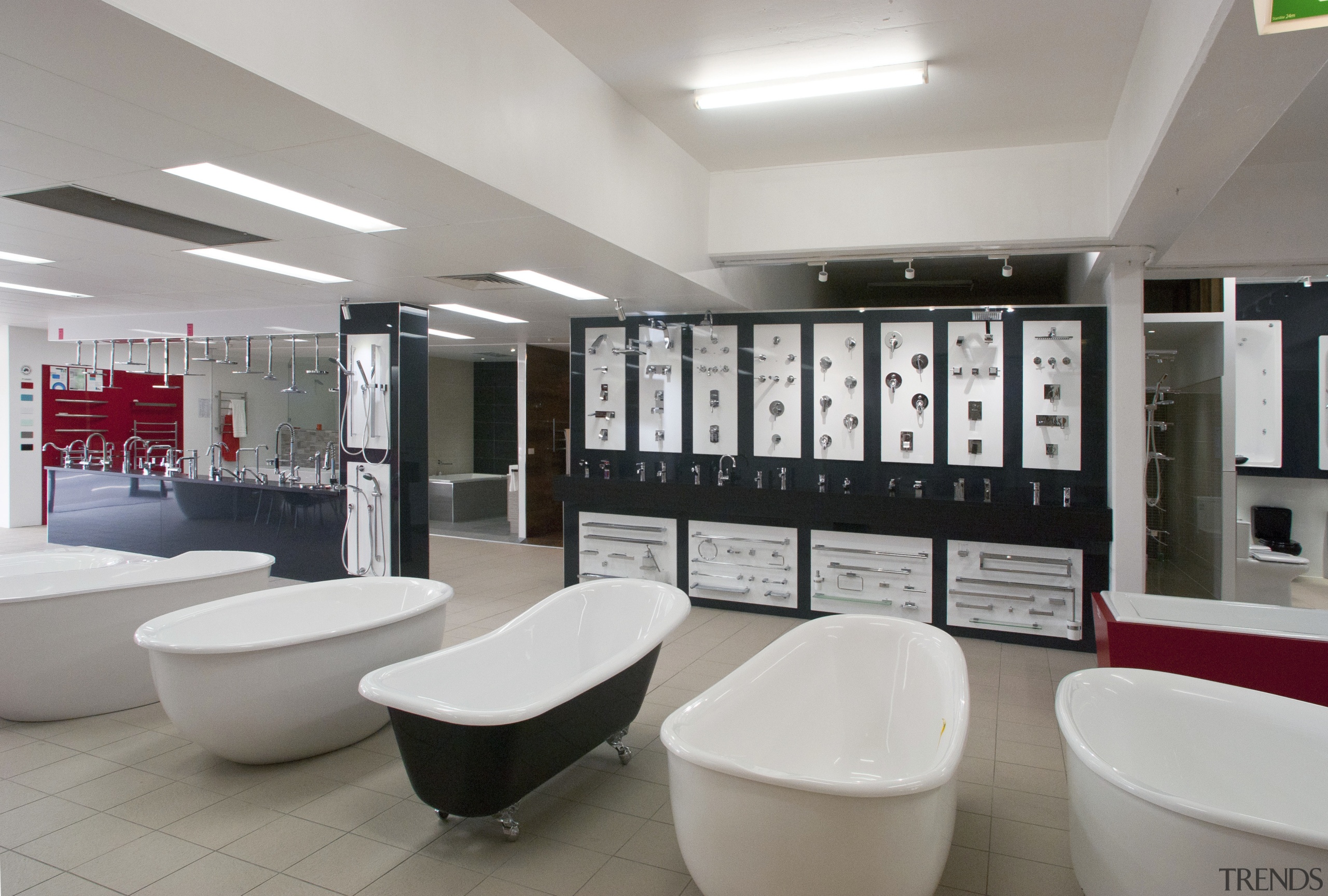 A range of bathtubs on shopfloor - A bathroom, interior design, product design, gray