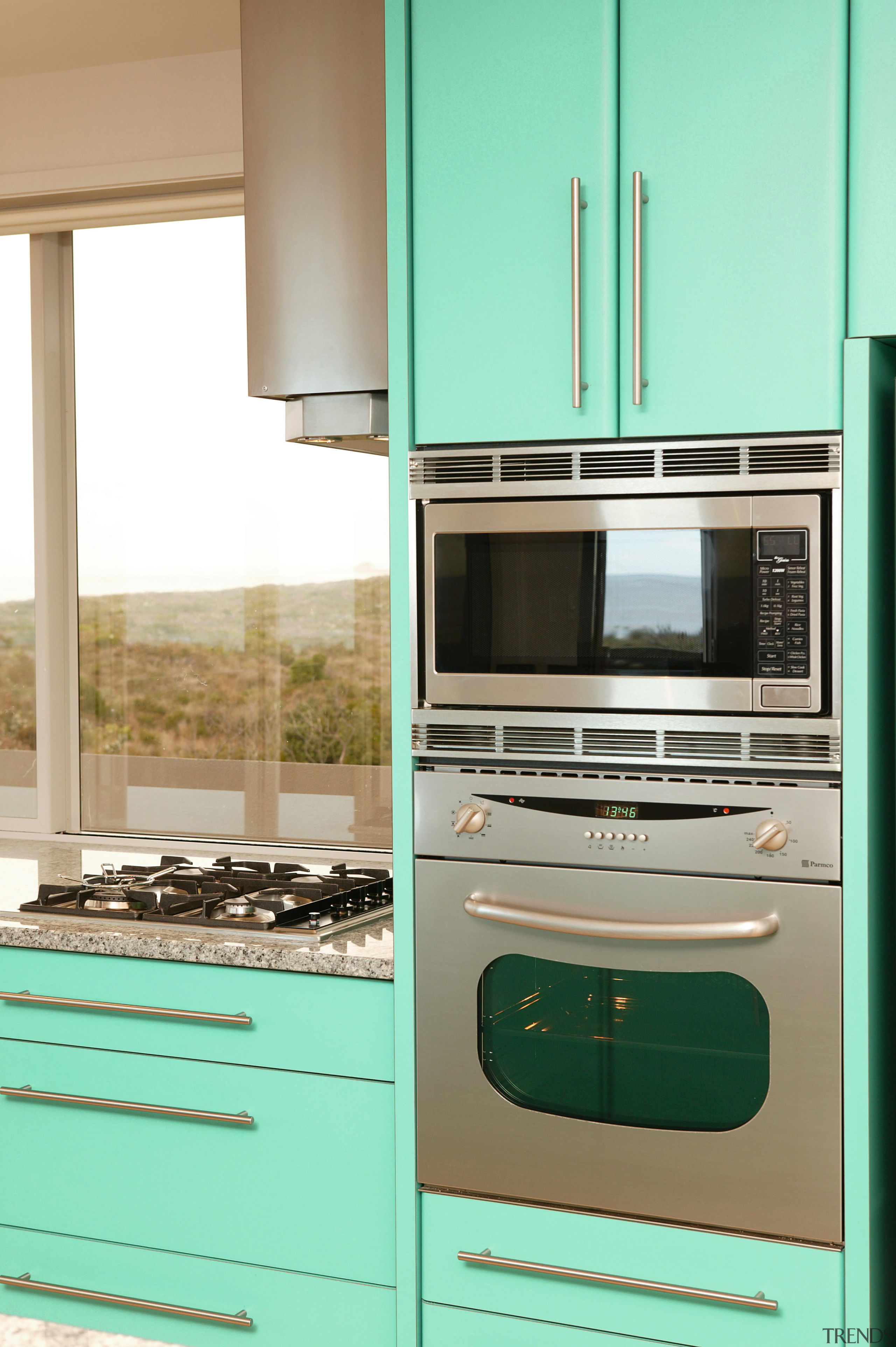 Kitchen with stainless steel wall oven and microwave countertop, home appliance, kitchen, kitchen appliance, major appliance, room, teal