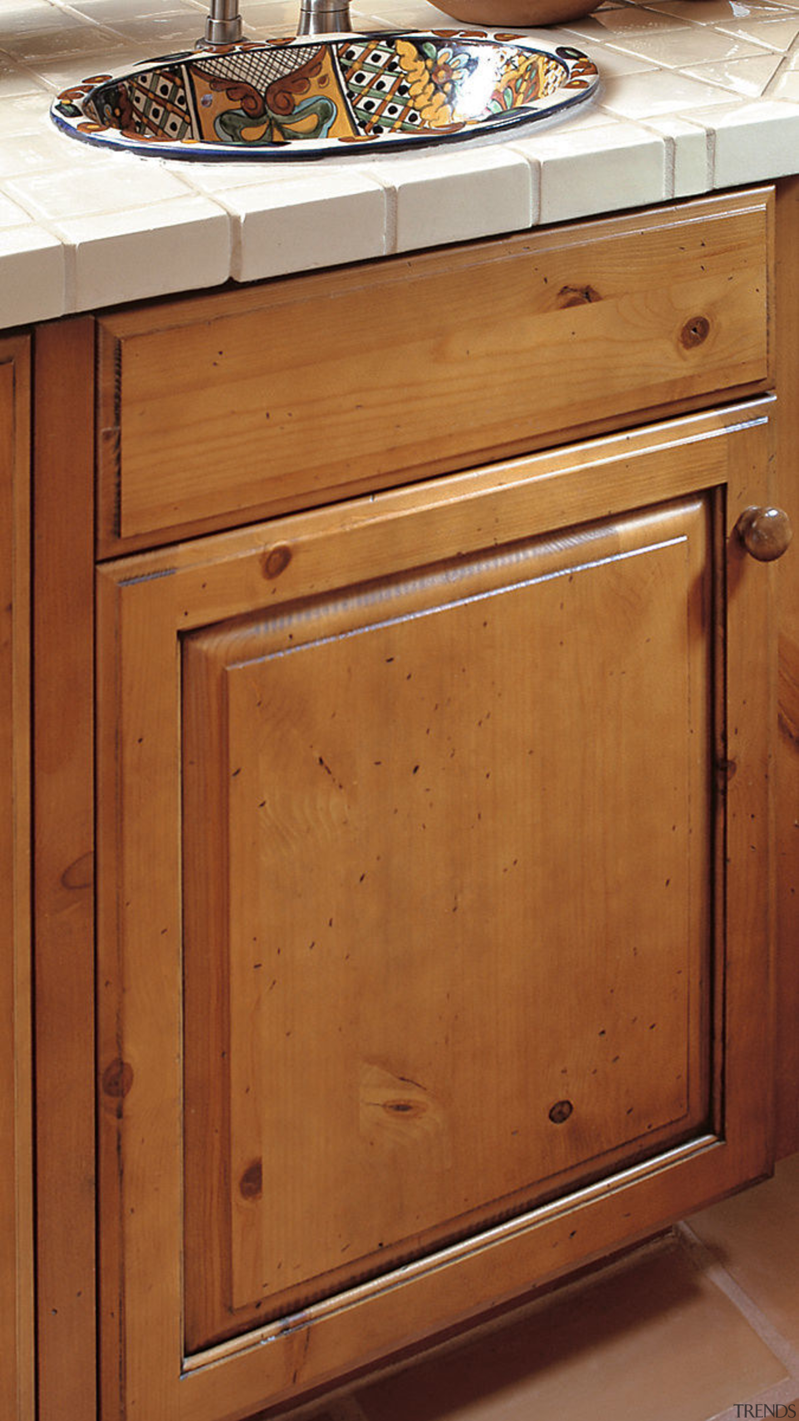 view of  this glazed kitchen cabinet, where cabinetry, chest of drawers, countertop, drawer, floor, flooring, furniture, hardwood, home appliance, kitchen, kitchen stove, sink, wood, wood stain, brown