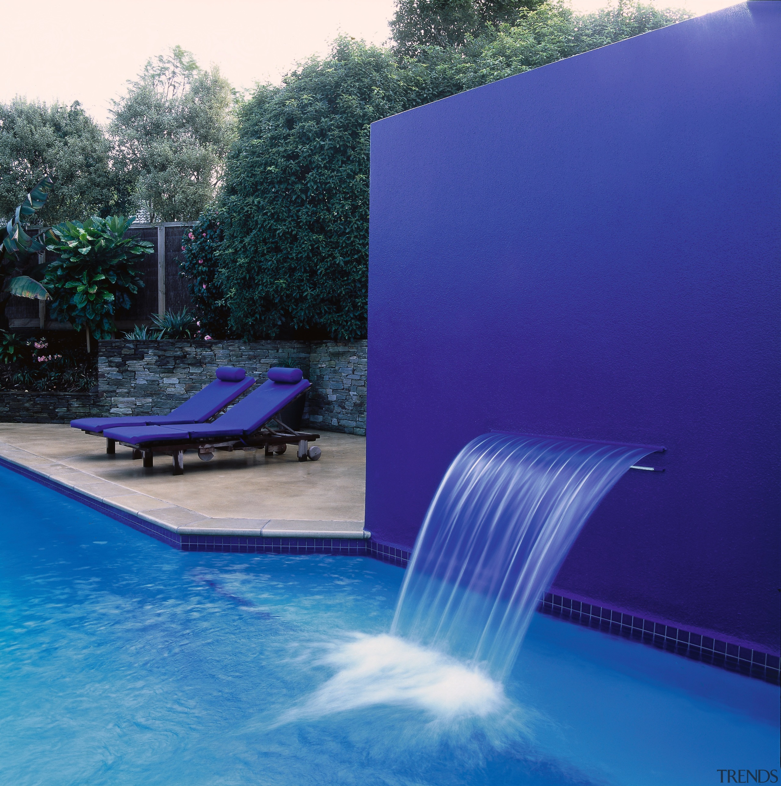 Pool with large royal blue feature wall and backyard, blue, leisure, light, lighting, reflection, swimming pool, water, water feature, water resources, blue