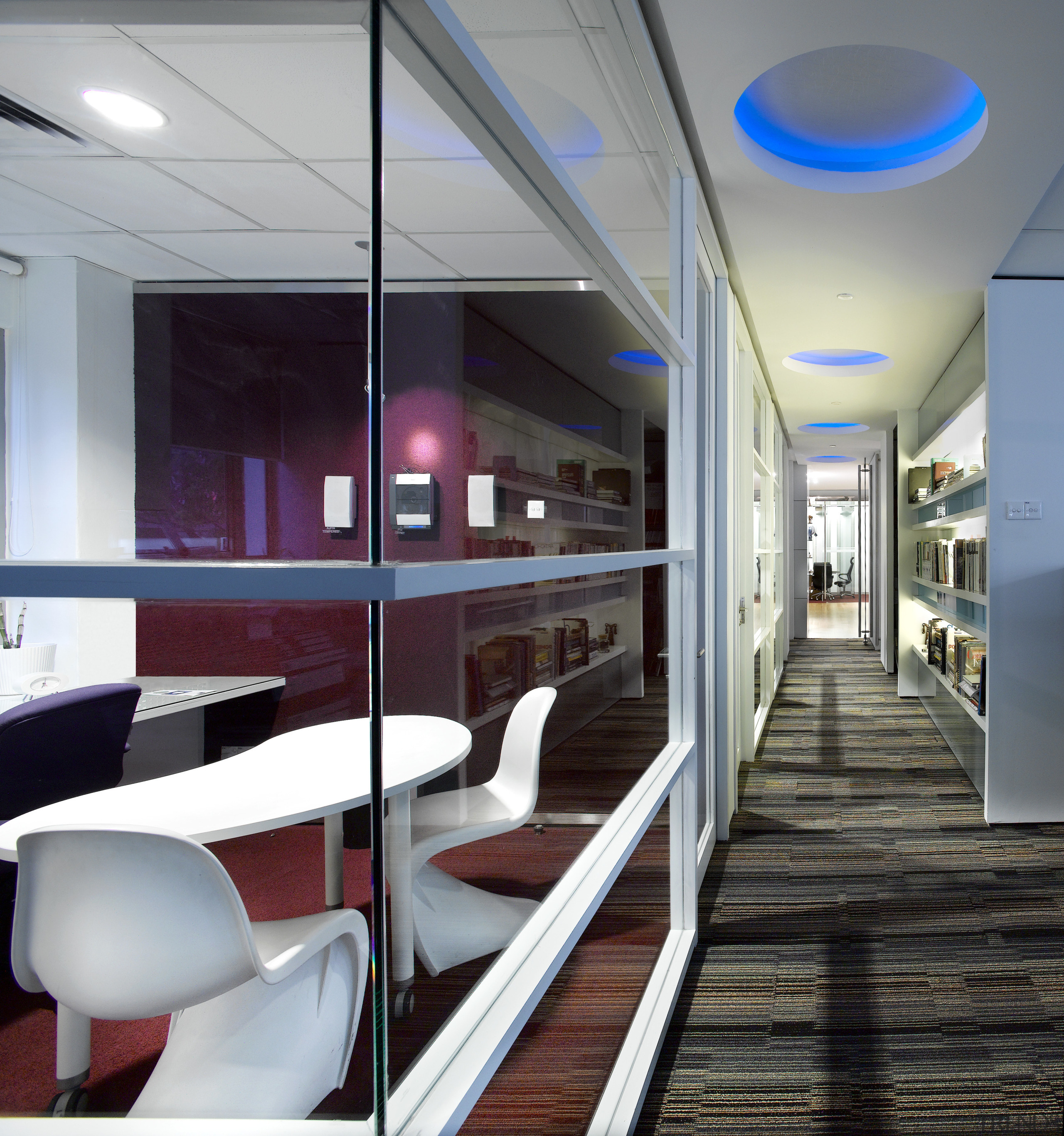 A view of SLA offices featuring carpet flooring, architecture, ceiling, interior design, gray