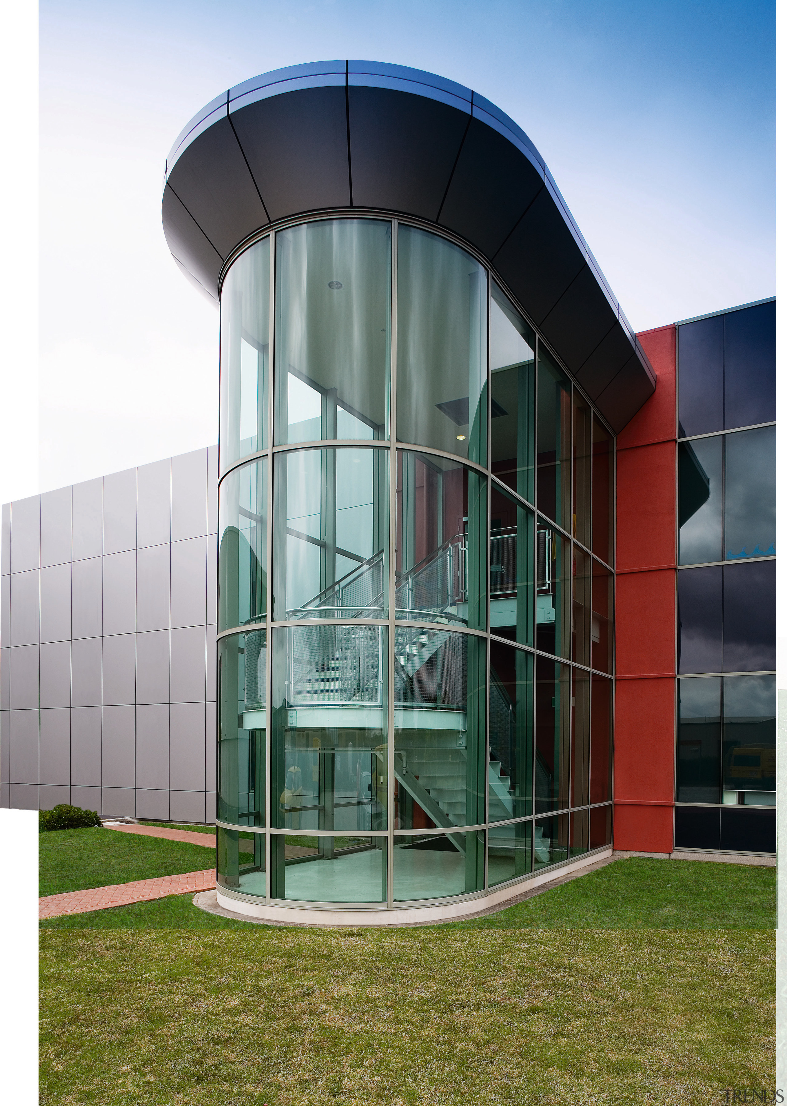 View of the sleek gass curved atrium at architecture, building, commercial building, corporate headquarters, facade