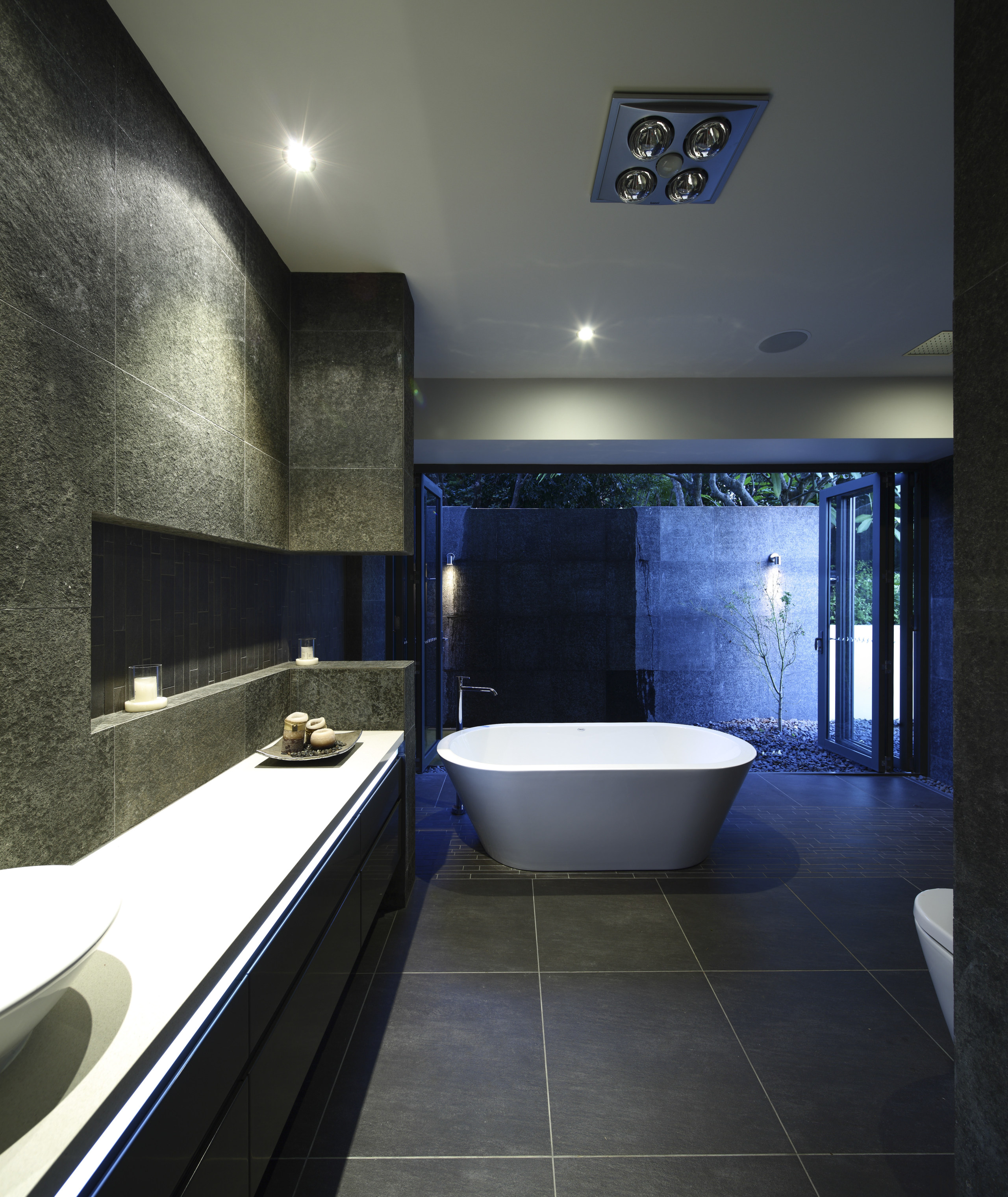 View of dark-toned bathroom with white tub. - architecture, bathroom, ceiling, daylighting, estate, interior design, room, black, gray