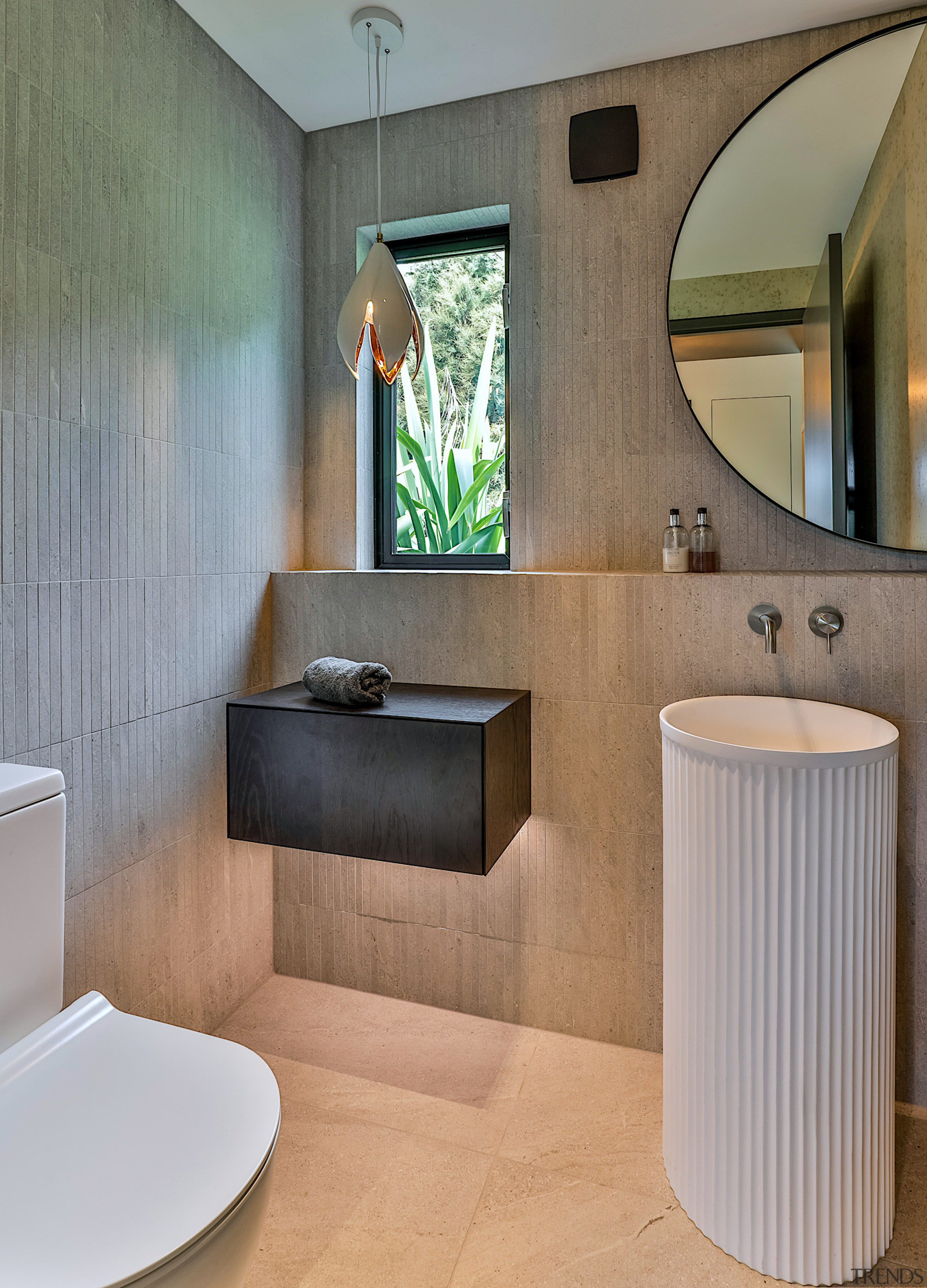 The modern WC reflects refined material choices. 