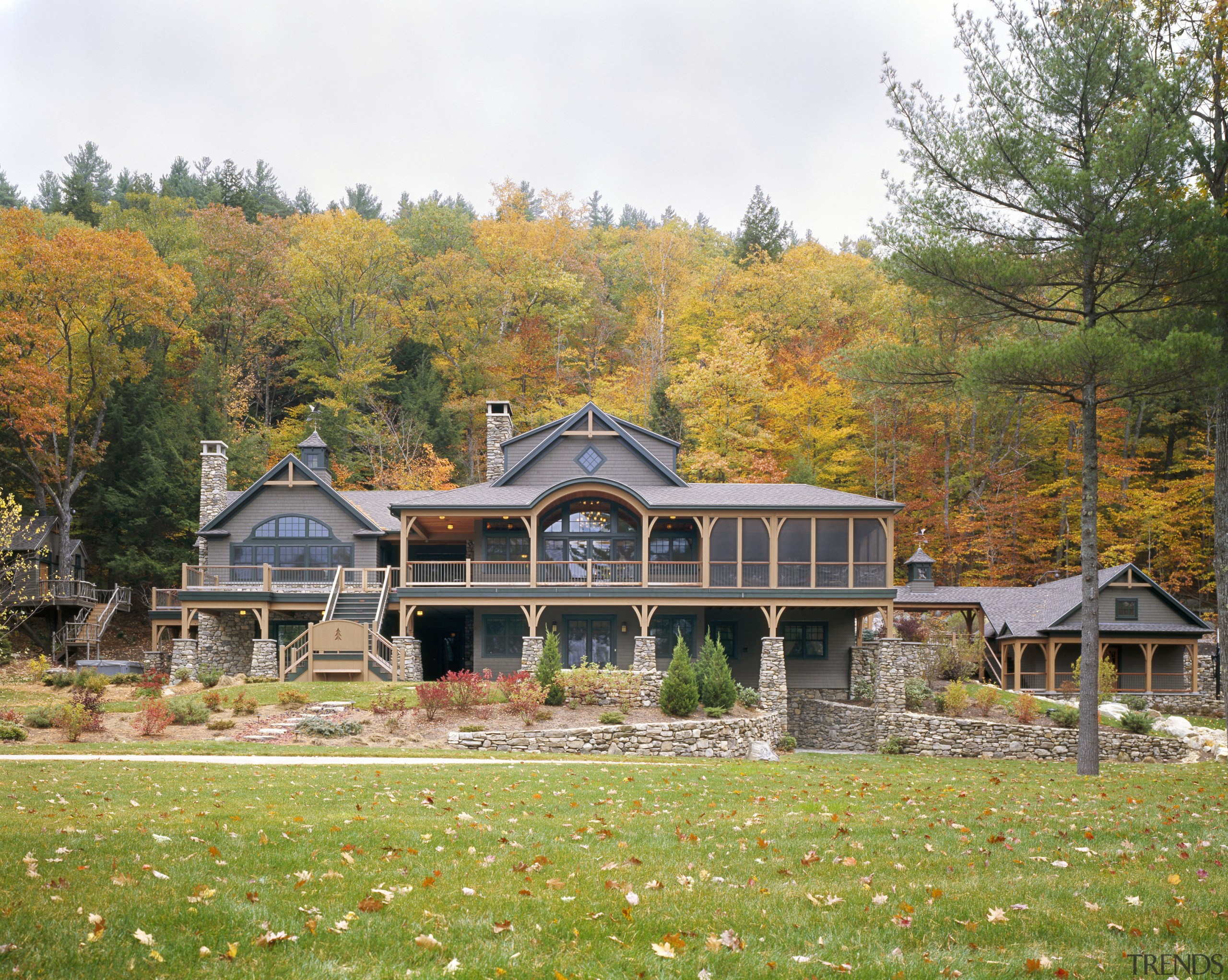 View of the holiday homes exterior featuring white autumn, cottage, estate, facade, farmhouse, grass, home, house, landscape, leaf, log cabin, mansion, plant, property, real estate, tree