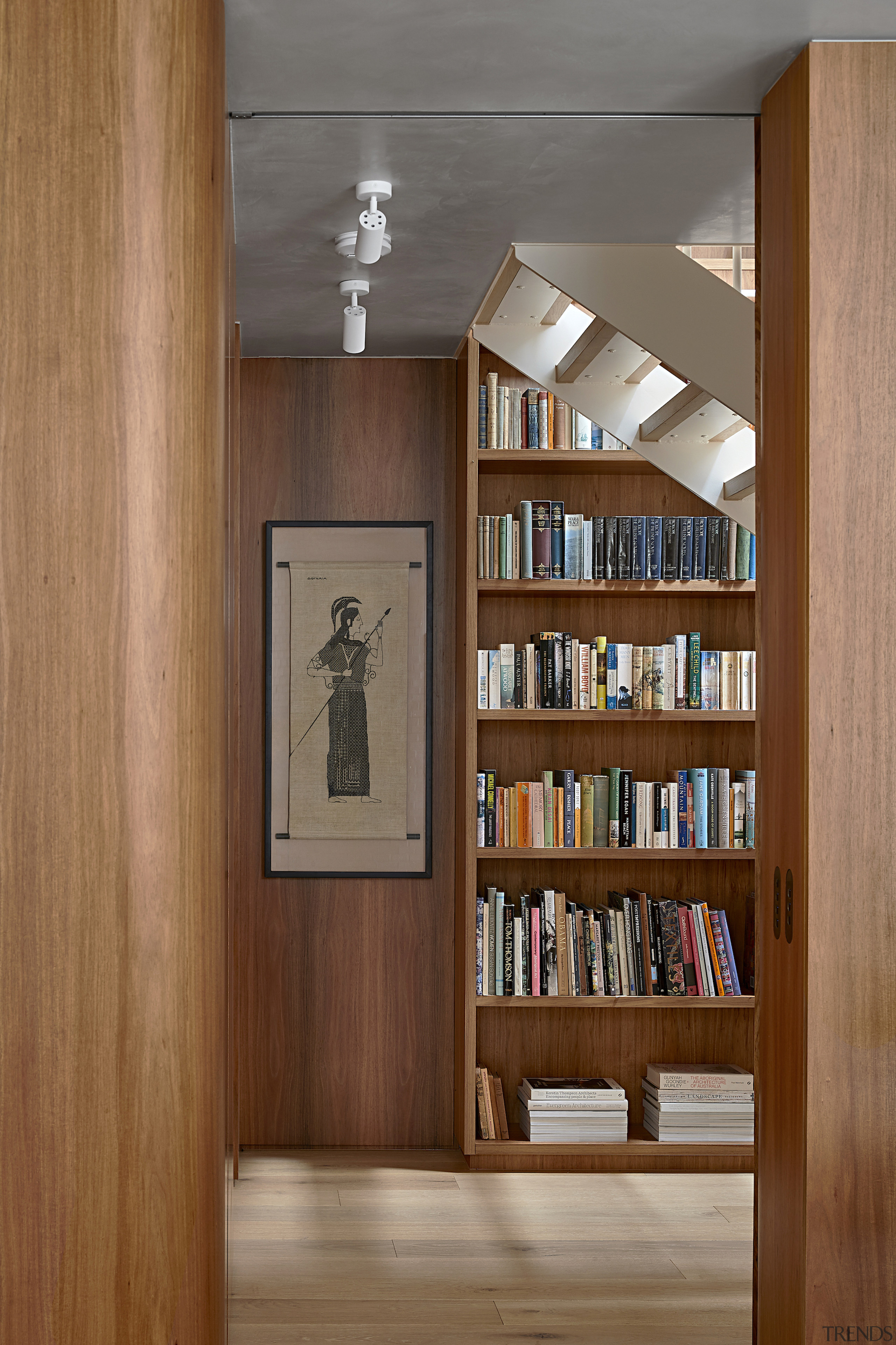 Spotlights highlight artworks in the art-infused residence. 